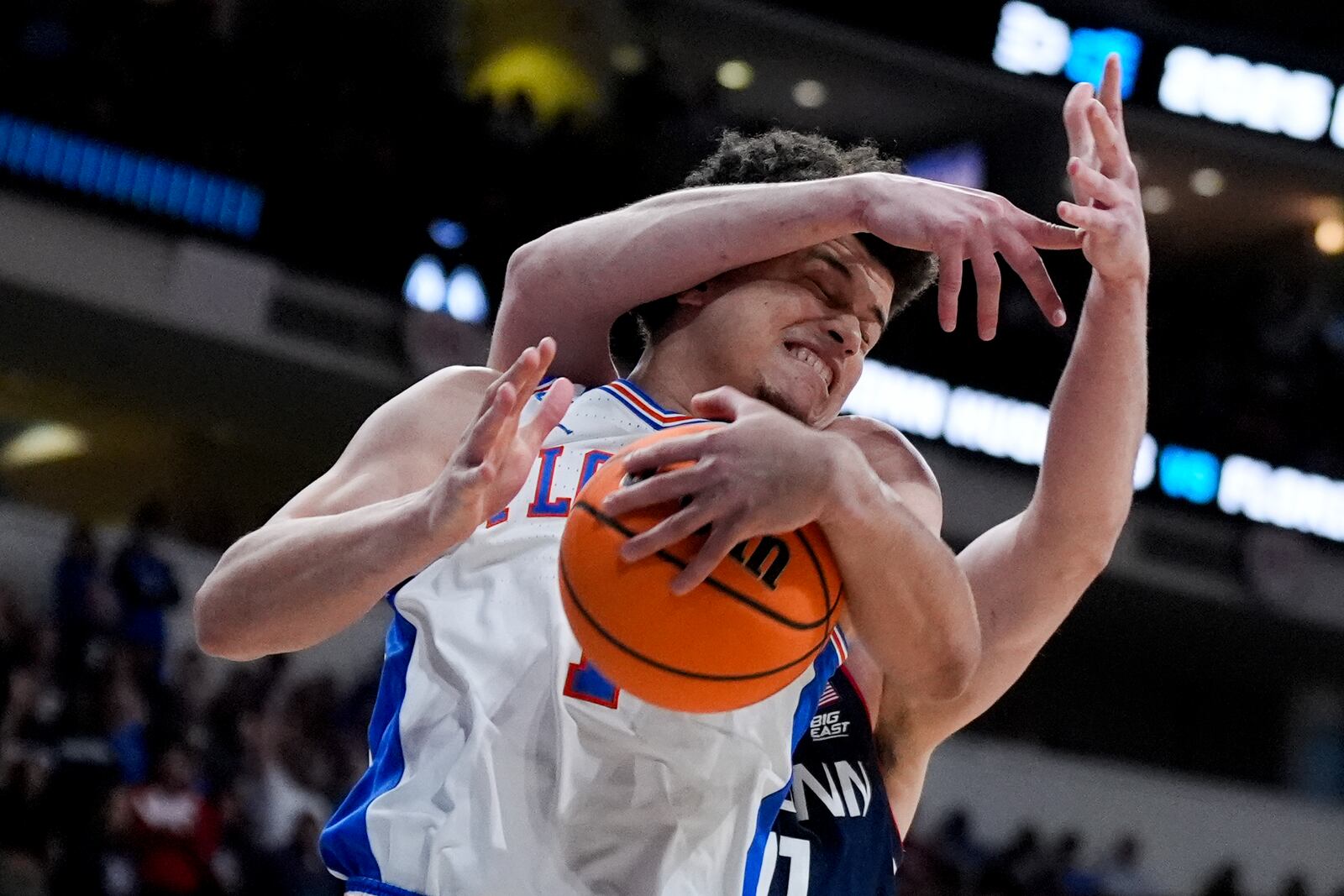 Florida guard Walter Clayton Jr. collides with UConn forward Alex Karaban during the first half in the second round of the NCAA college basketball tournament, Sunday, March 23, 2025, in Raleigh, N.C. (AP Photo/Chris Carlson)