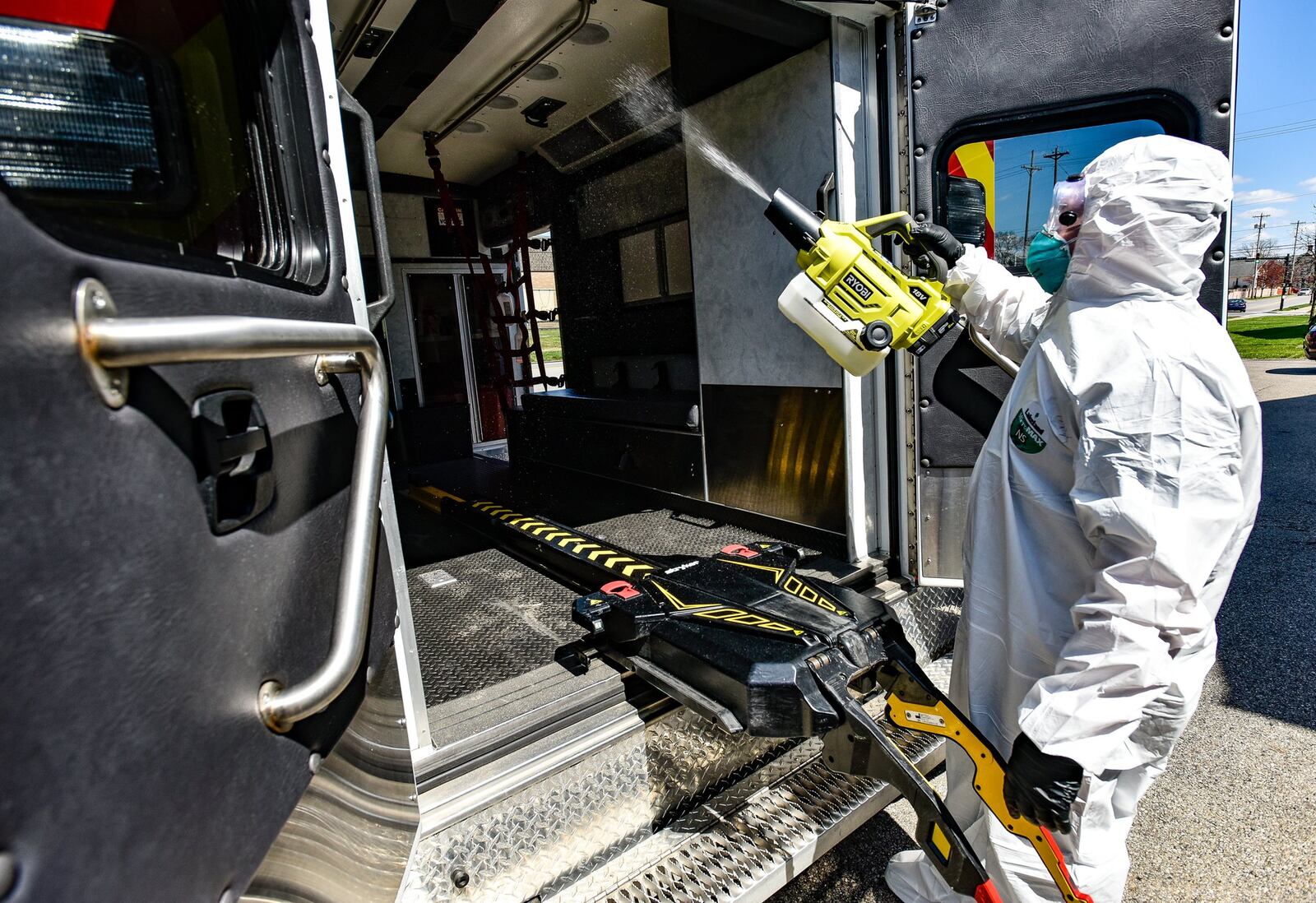 Hamilton firefighter paramedic Jason Bunger puts on his protective gear to demonstrate the decontamination process they are doing to medic units in response to the coronavirus (COVID-19) pandemic. They are using a fogger to coat the inside of the unit with disinfectant and wiping down the inside after ten minutes. NICK GRAHAM / STAFF