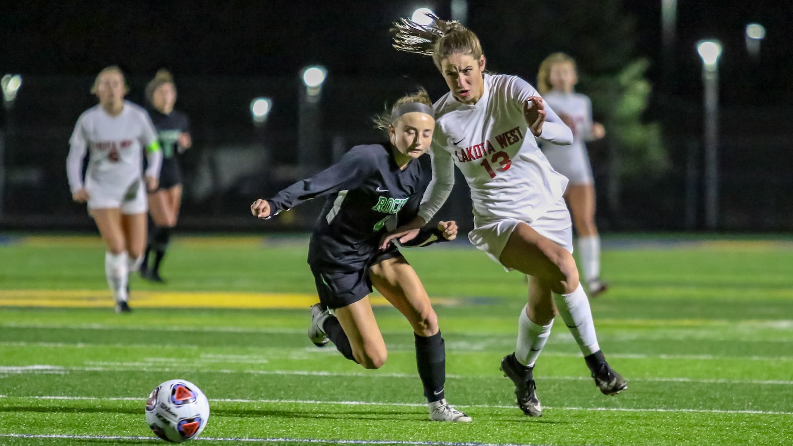 Lakota West High School junior Kailyn Dudukovich tussles with Dublin Coffman's Amanda Bailey during a Division I state semifinal match on Tuesday night at Springfield High School. Dudukovich scored two goals in the win