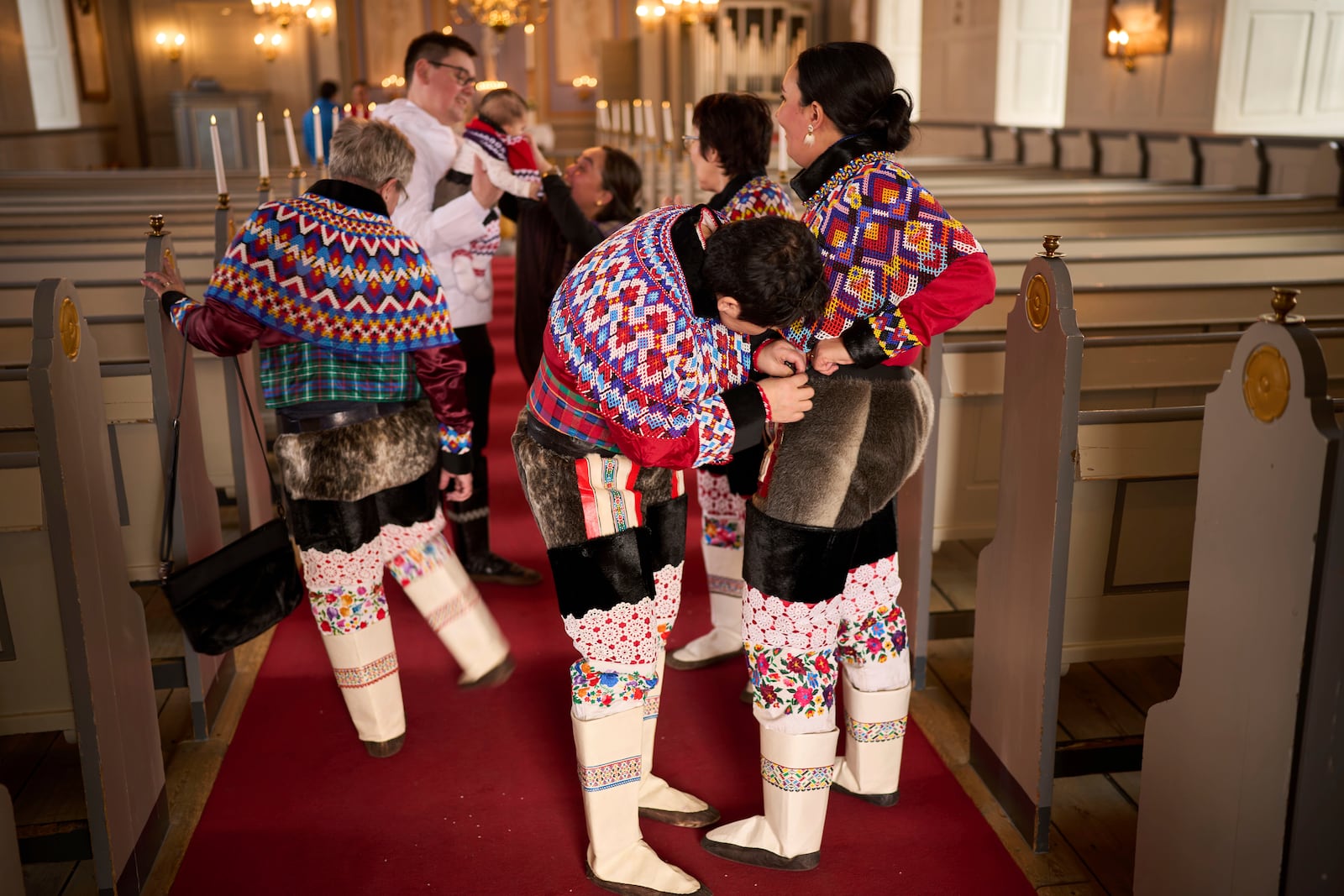 Salik Schmidt and Malu Schmidt arrive at the church of our Savior before getting married in Nuuk, Greenland, Saturday, Feb. 15, 2025. (AP Photo/Emilio Morenatti)