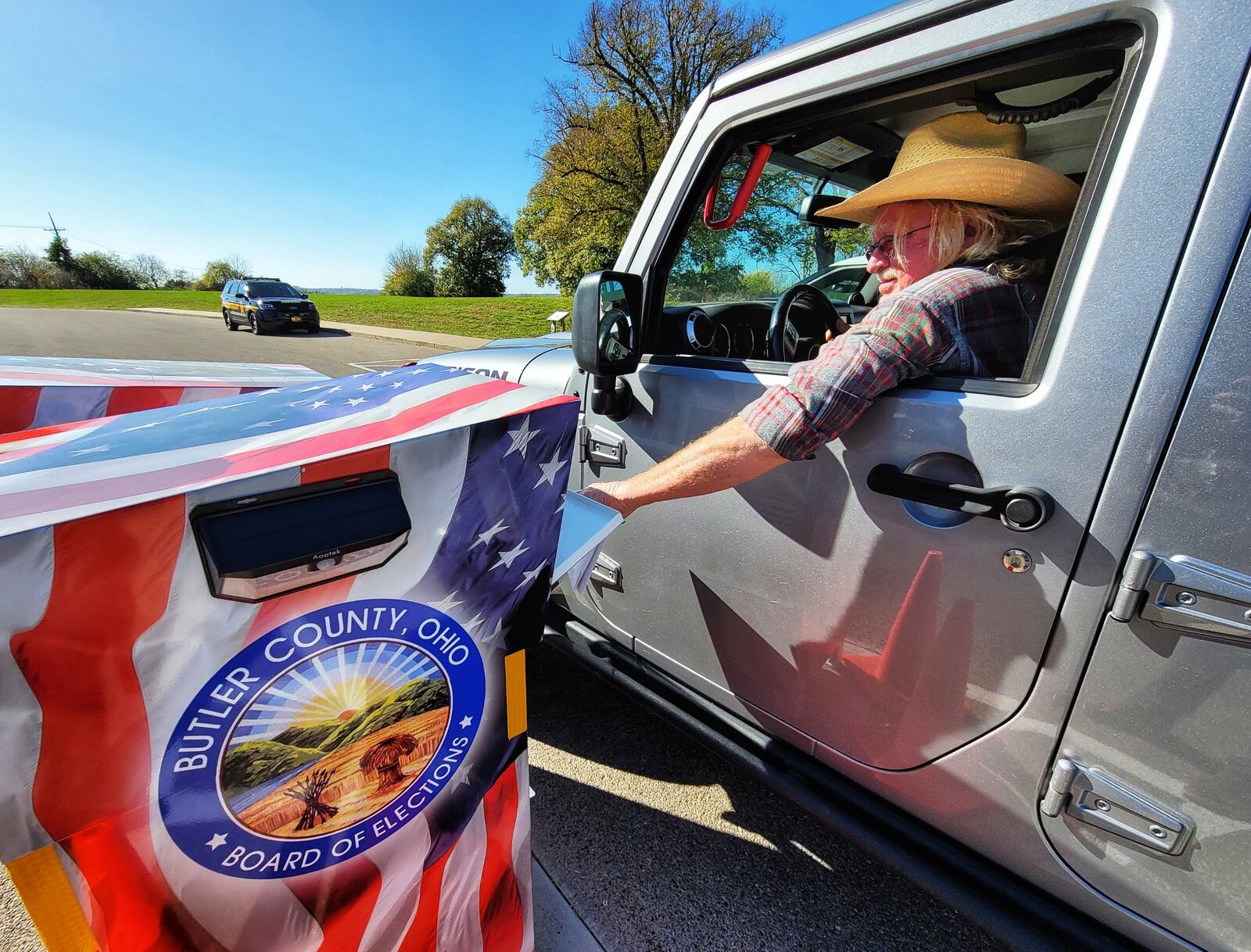 Bob Arnold places his absentee ballot in the drop box at Butler County Board of Elections on election day Tuesday, Nov. 3, 2020 in Hamilton. NICK GRAHAM / STAFF