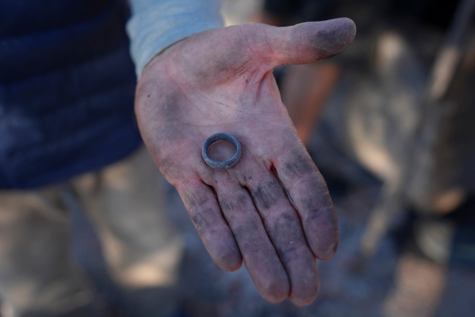 Bill Nardoni shows his wedding ring that was found in the remains of his home destroyed by the Mountain Fire in Camarillo, Calif., Friday, Nov. 8, 2024. (AP Photo/Jae C. Hong)