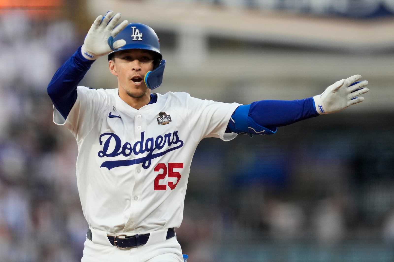 Los Angeles Dodgers' Tommy Edman celebrates a home run against the New York Yankees during the second inning in Game 2 of the baseball World Series, Saturday, Oct. 26, 2024, in Los Angeles. (AP Photo/Ashley Landis)