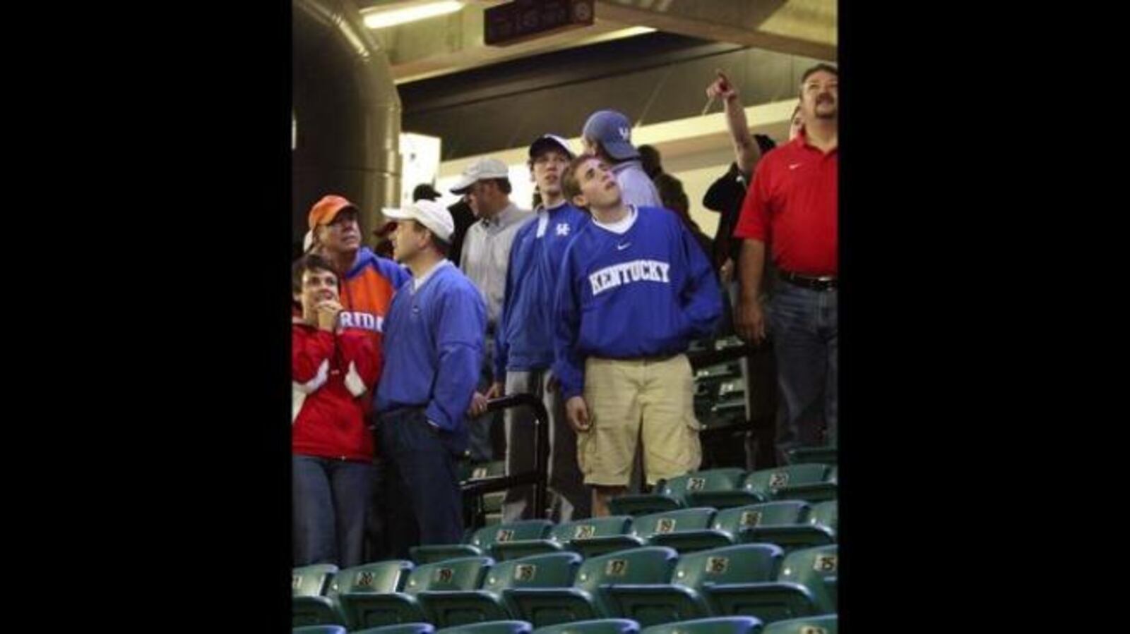 Fans observe damage to the Georgia Dome after a tornado struck downtown Atlanta during the SEC Tournament in 2008.
(AJC file photo)