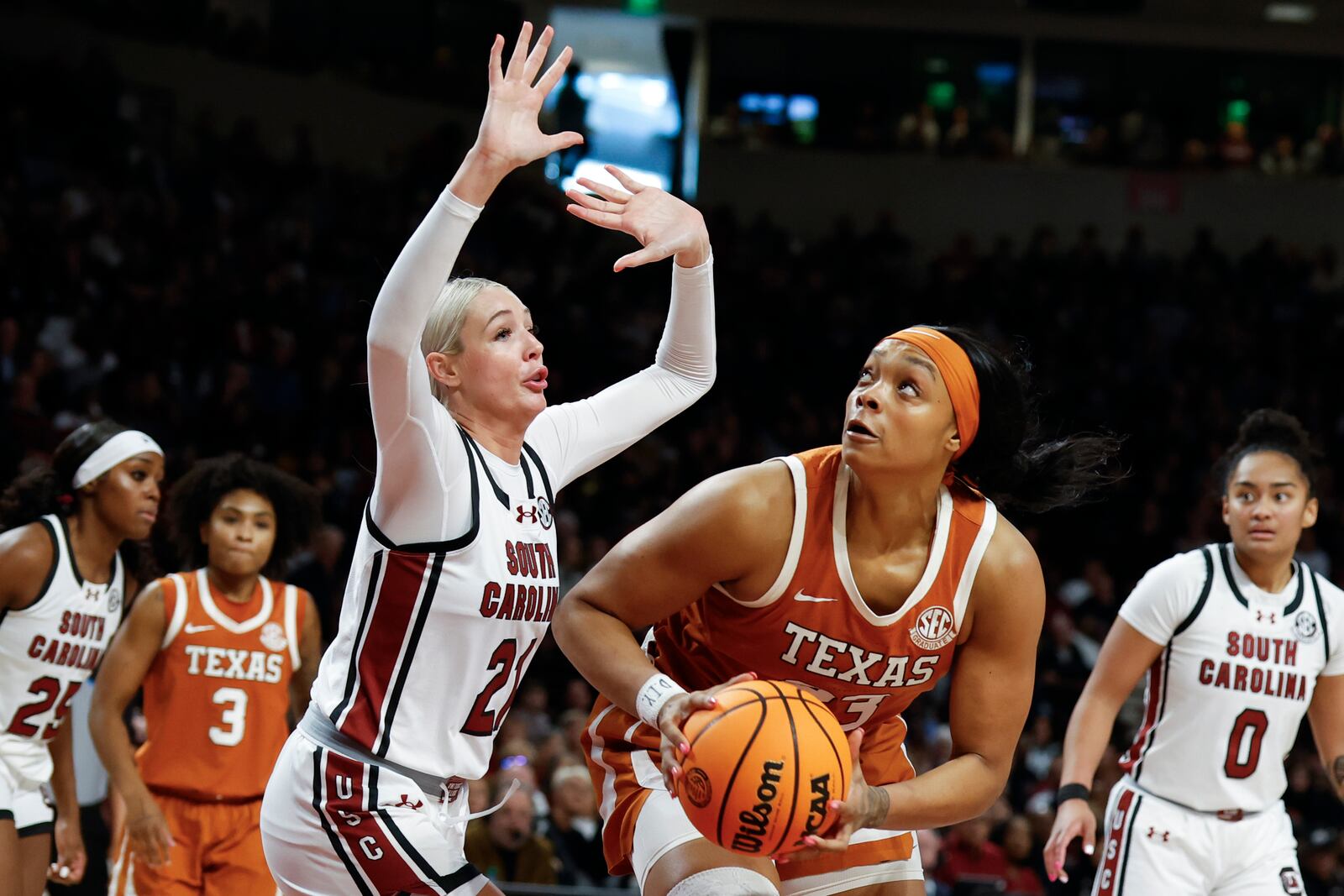 Texas forward Aaliyah Moore looks to shoot against South Carolina forward Chloe Kitts (21) during the second half of an NCAA college basketball game in Columbia, S.C., Sunday, Jan. 12, 2025. (AP Photo/Nell Redmond)