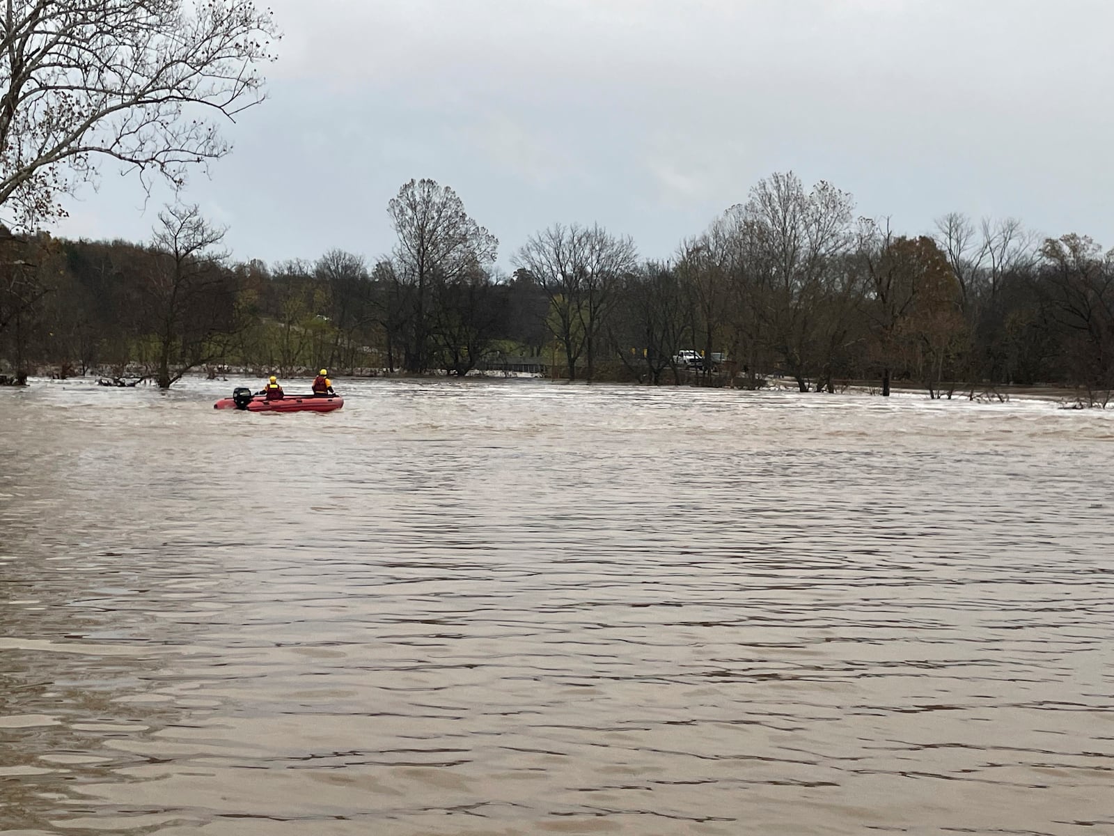 In a photo released by the Missouri State Highway Patrol, patrol vehicles and rescue boats are from rescue efforts on a swollen river in Manes Mo., Tuesday, Nov. 5, 2024. (Missouri State Highway Patrol via AP)