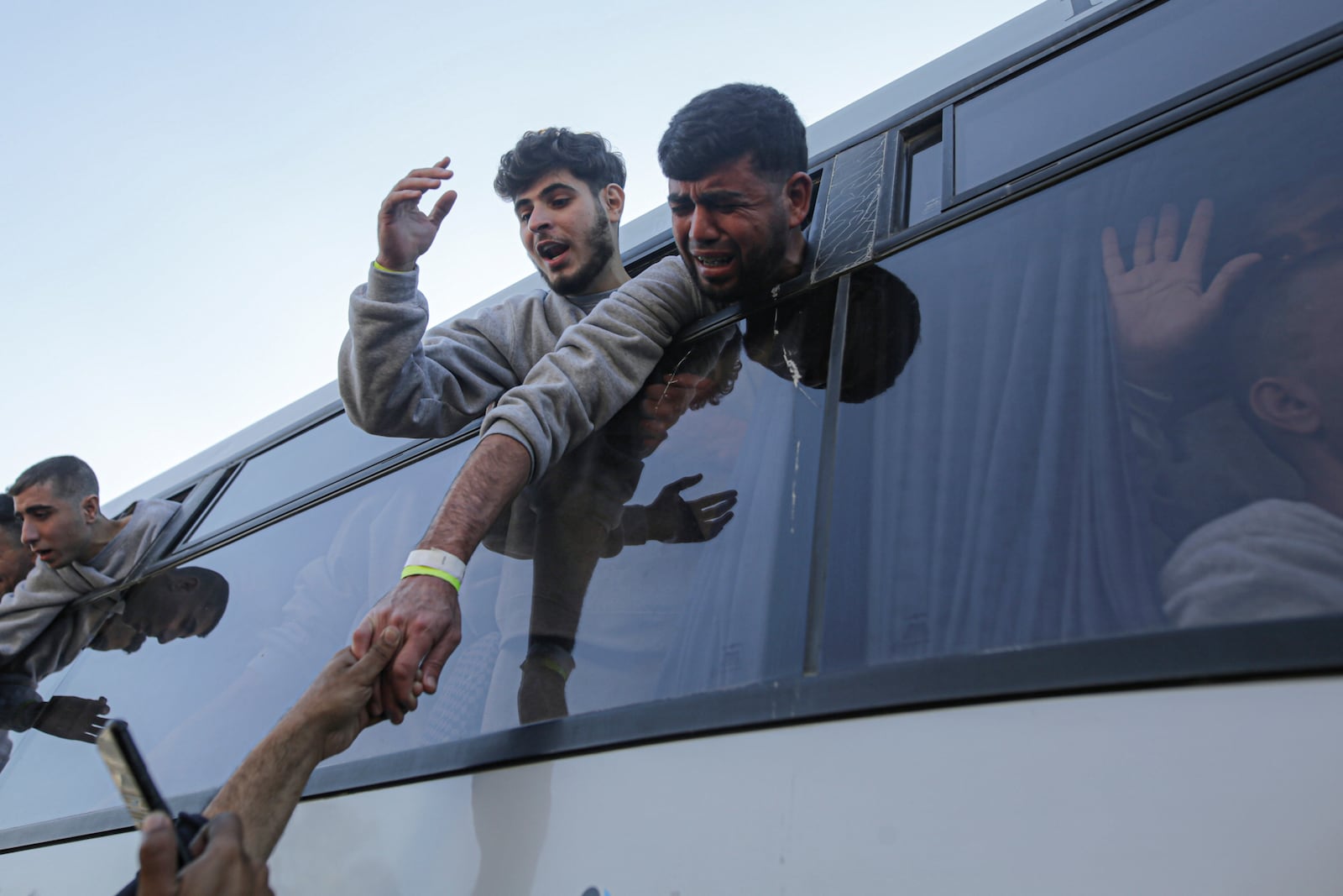 Freed Palestinian prisoners react as they arrive in the Gaza Strip after being released from an Israeli prison following a ceasefire agreement between Hamas and Israel in Khan Younis, Saturday, Feb. 1, 2025. (AP Photo/Jehad Alshrafi)