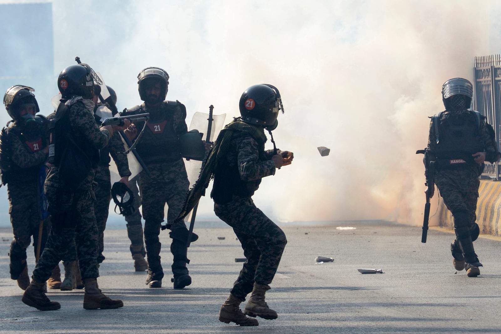 Paramilitary soldiers fire tear gas shells to disperse supporters of imprisoned former premier Imran Khan's Pakistan Tehreek-e-Insaf party, during clashes, in Islamabad, Pakistan, Tuesday, Nov. 26, 2024. (AP Photo/Irtisham Ahmed)