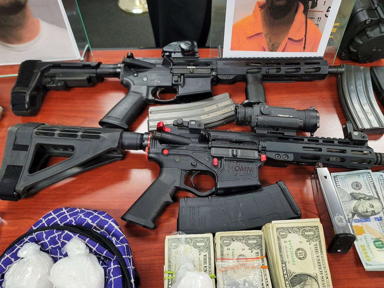 A four-month investigation by the Butler County Sheriff’s Office Undercover Regional Narcotics Unit and the Cincinnati DEA concluded Wednesday with the arrest of two men and seizure of guns, cash and drugs worth $100,000. NICK GRAHAM/STAFF