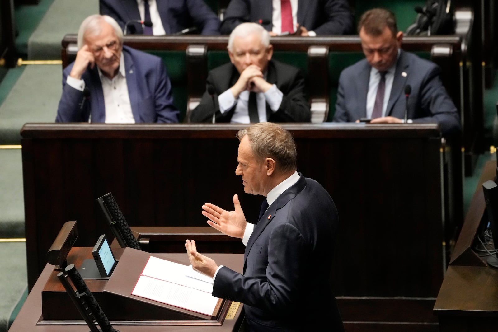 Polish Prime Minister Donald Tusk speaks at the Sejm, the lower house of parliament, in Warsaw, Poland, Friday March 7, 2025. (AP Photo/Czarek Sokolowski)