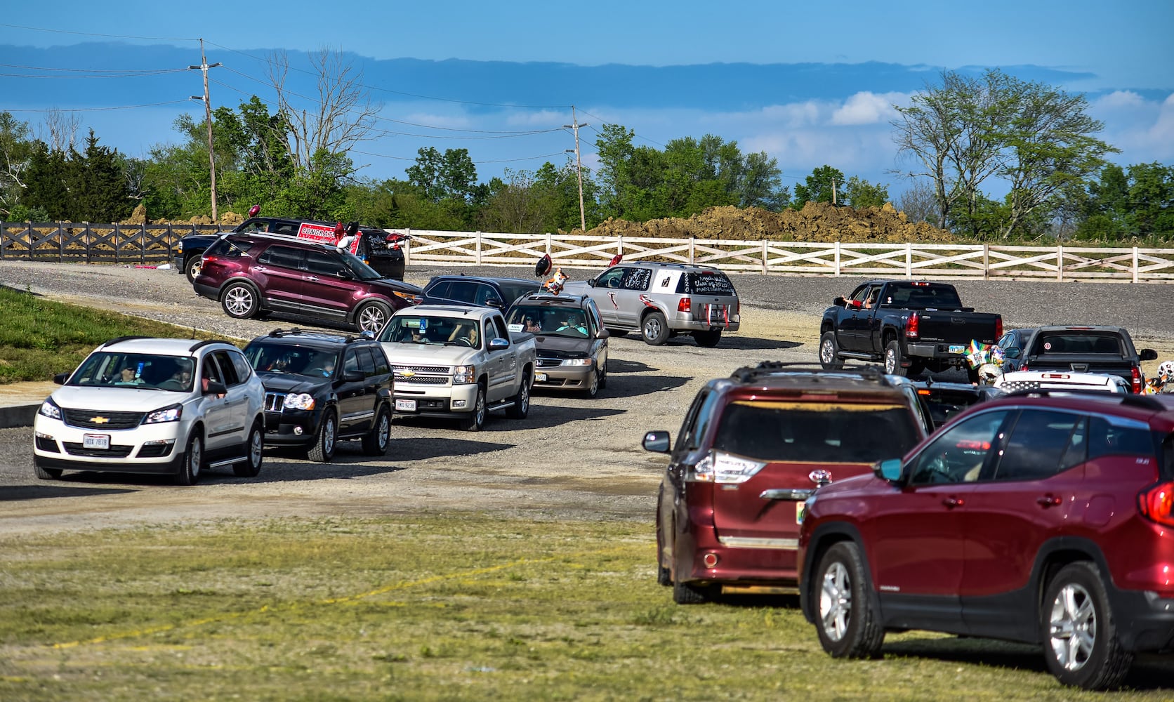 Madison High School drive-thru graduation ceremony at Land of Illusion