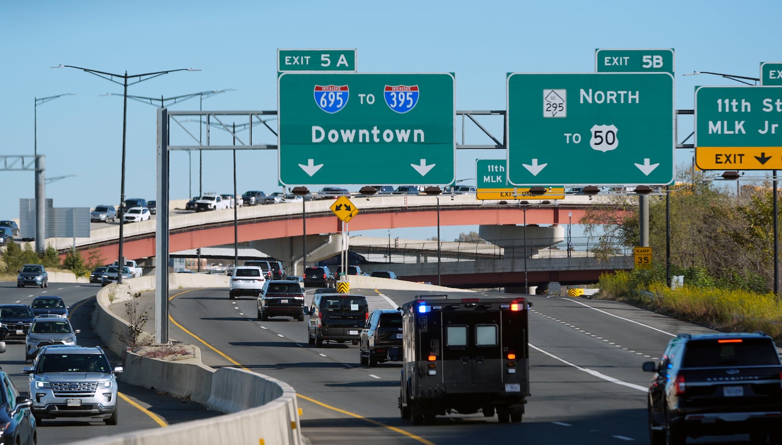 President-elect Donald Trump's motorcade drives through downtown Washington, as he travels to a meeting with the House GOP conference, Wednesday, Nov. 13, 2024, in Washington. (AP Photo/Alex Brandon)