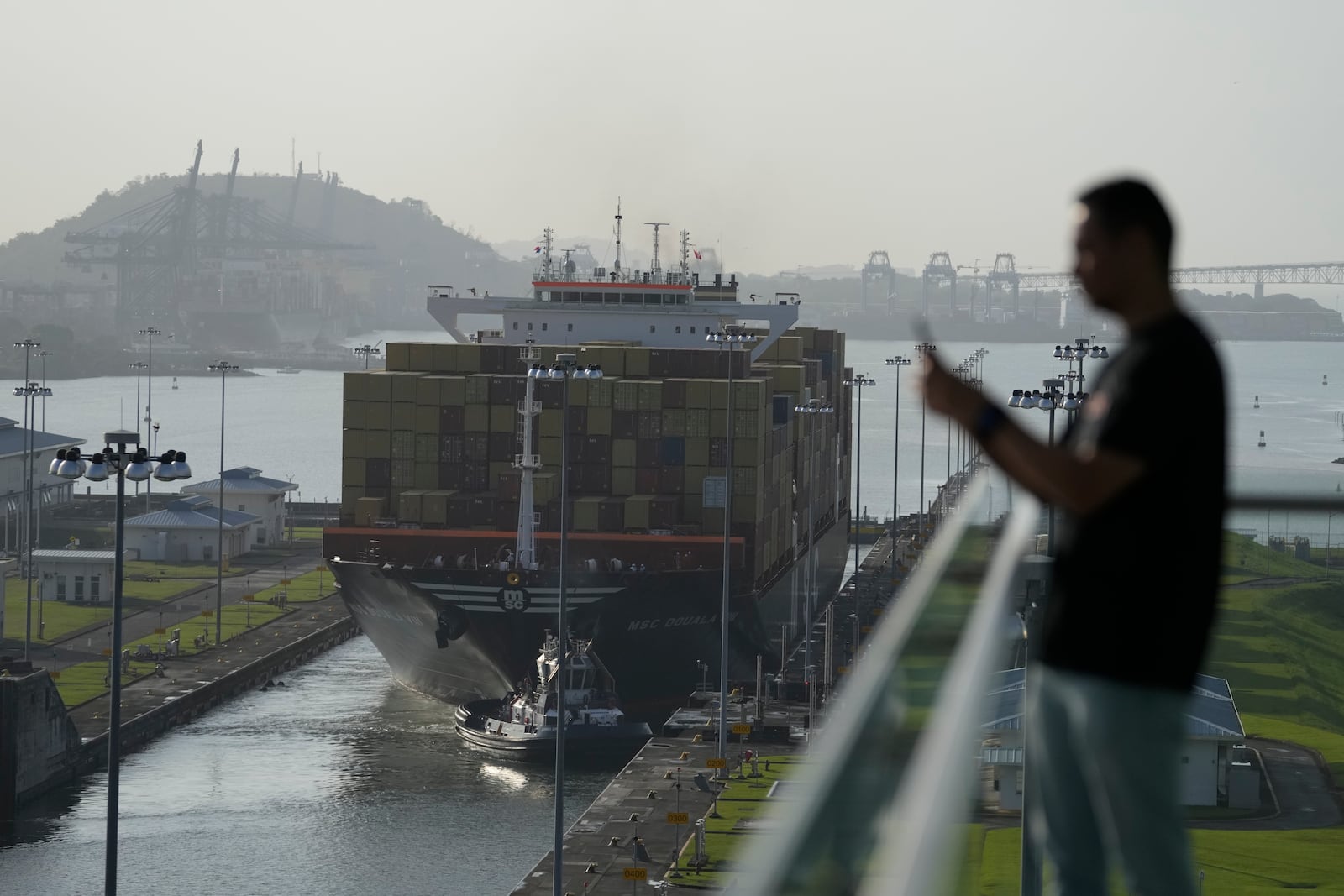 FILE - A cargo ship goes through the Panama Canal's Cocoli locks in Panama City, Feb. 21, 2025. (AP Photo/Matias Delacroix, File)