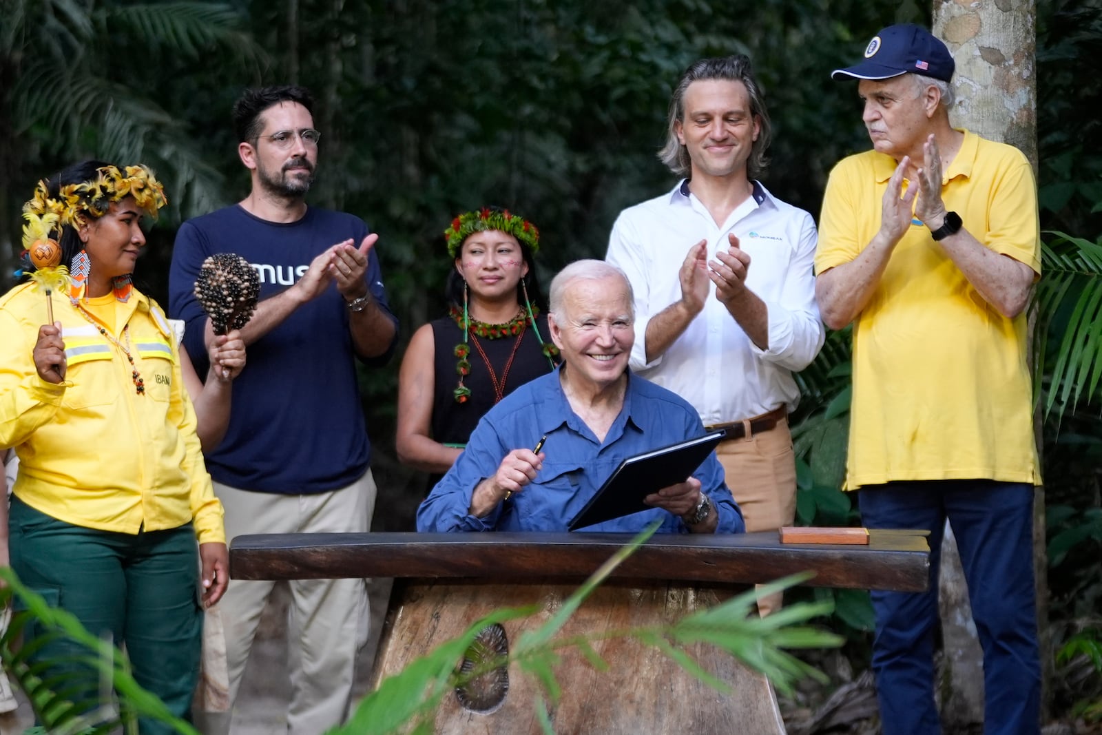 President Joe Biden signs a proclamation designating Nov. 17 as International Conservation Day following a tour of the Museu da Amazonia, Sunday, Nov. 17, 2024, in Manaus, Brazil. (AP Photo/Manuel Balce Ceneta)