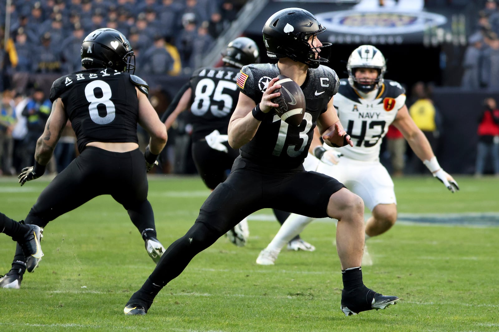 Army quarterback Bryson Daily (13) sets to throw a pass during the first half of an NCAA college football game against Navy, Saturday, Dec. 14, 2024, in Landover, Md. (AP Photo/Daniel Kucin Jr.)