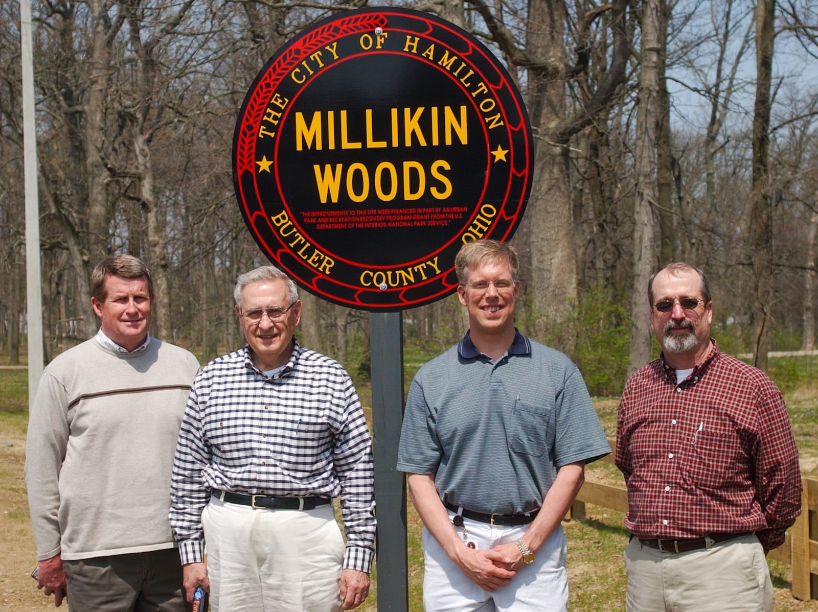 Bill Phelps, Judge John Moser, Robert Harris, and Don Kolb, under the Millikin Woods sign on Washington Blvd. Thursday, 4/15/04. E.L. HUBBARD/JOURNALNEWS