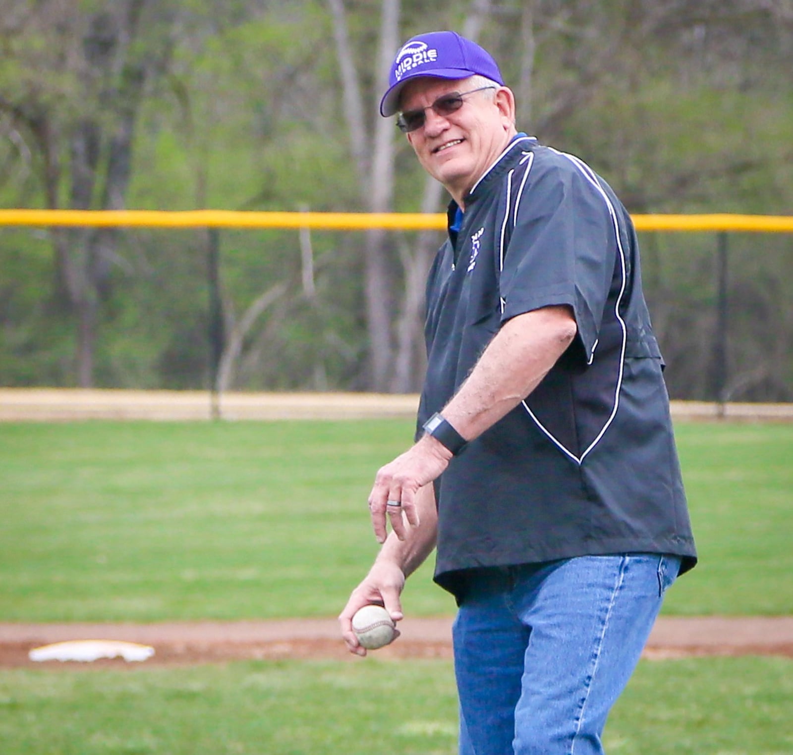 A ceremonial first pitch was thrown by Greg Schwarber, father of former Middie and Chicago Cub Kyle Schwarber, during Opening Day ceremonies for the Middies baseball and softball teams at the newly renovated Lefferson Park complex Monday. GREG LYNCH/STAFF