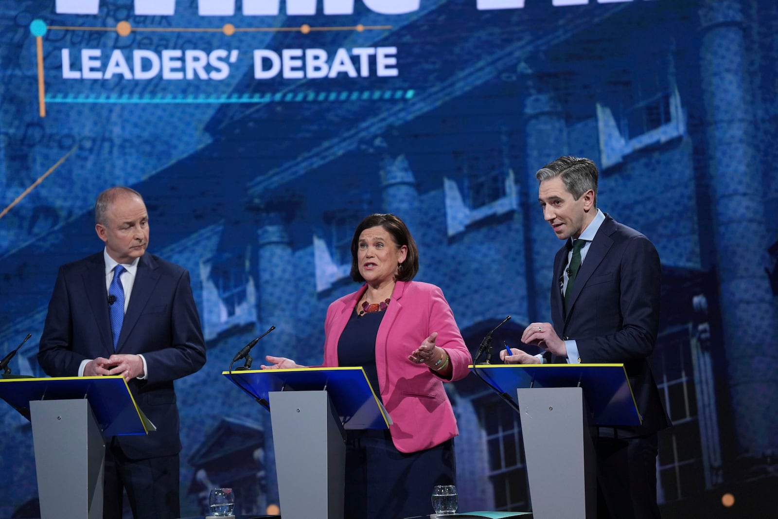 Tanaiste and Fianna Fail Leader Micheal Martin, from left, Sinn Fein leader Mary Lou McDonald and Taoiseach and Fine Gael leader Simon Harris speak during the final TV leaders' debate, at RTE studios in Donnybrook, Dublin, ahead of the Nov. 29, General Election Tuesday, Nov. 26, 2024. (Niall Carson/PA via AP)