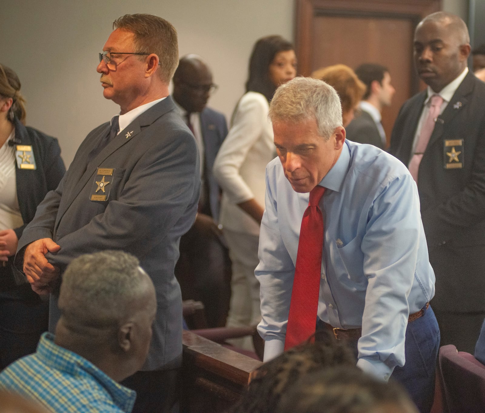 Former Brunswick Circuit District Attorney Jackie Johnson’s defense lawyer Brian Steel talks with Ahmaud Arbery’s father Marcus Arbery after a judge granted his motion to throw out the remaining charge against Johnson, Wednesday, Feb. 5, 2025, in Brunswick, Ga. (Terry Dickson/The Brunswick News via AP, Pool)