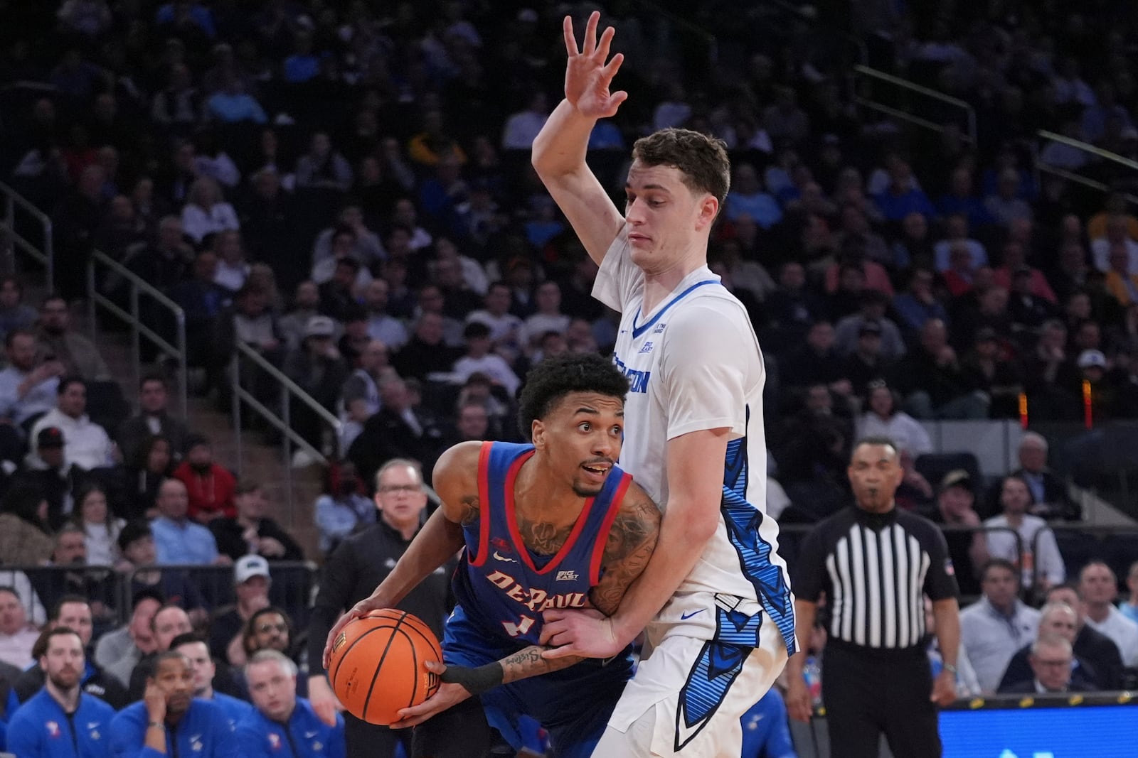 Creighton's Ryan Kalkbrenner, right, defends DePaul's CJ Gunn (11) during the second half of an NCAA college basketball game at the Big East basketball tournament Thursday, March 13, 2025, in New York. (AP Photo/Frank Franklin II)