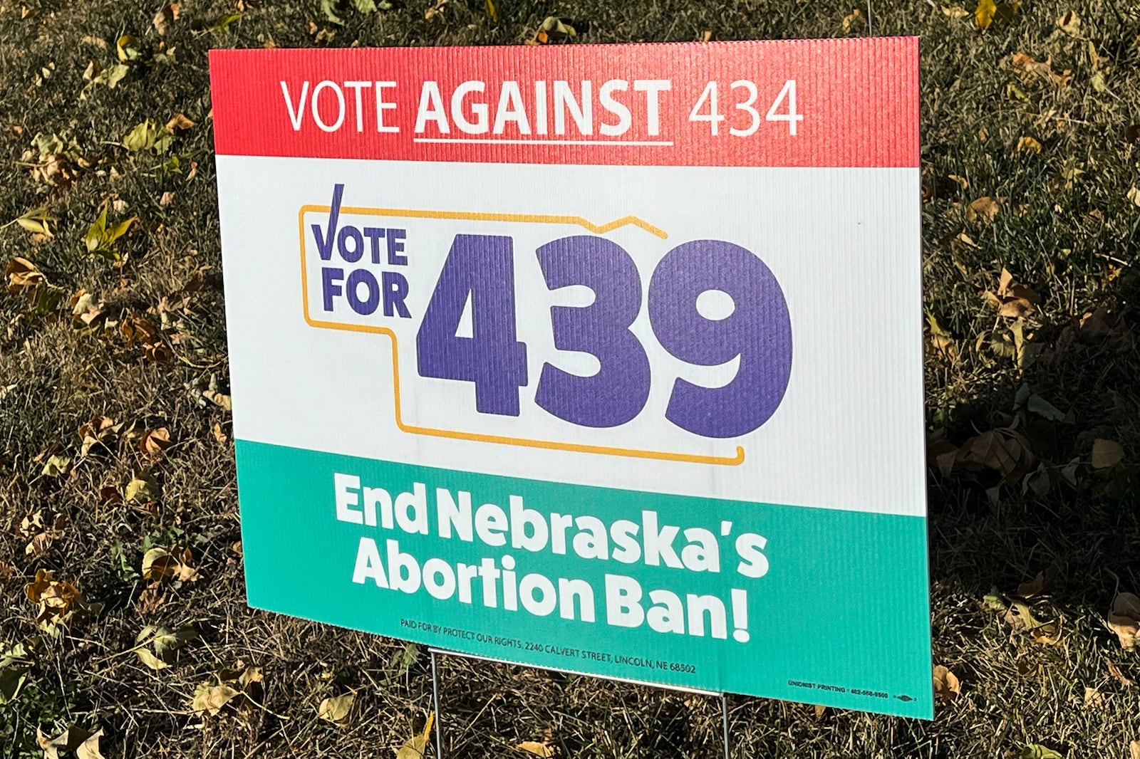 A sign supporting a ballot measure to expand abortion rights is seen in a yard, Friday, Oct. 18, 2024, in Omaha, Neb. (AP Photo/Margery Beck)