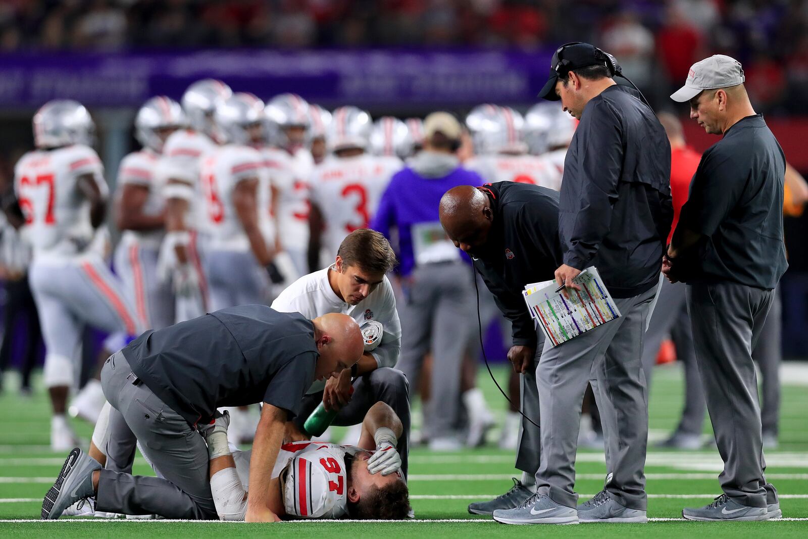 ARLINGTON, TX - SEPTEMBER 15:  Nick Bosa #97 of the Ohio State Buckeyes lays on the field after being injured in the third quarter against the TCU Horned Frogs during The AdvoCare Showdown at AT&T Stadium on September 15, 2018 in Arlington, Texas.  (Photo by Tom Pennington/Getty Images)