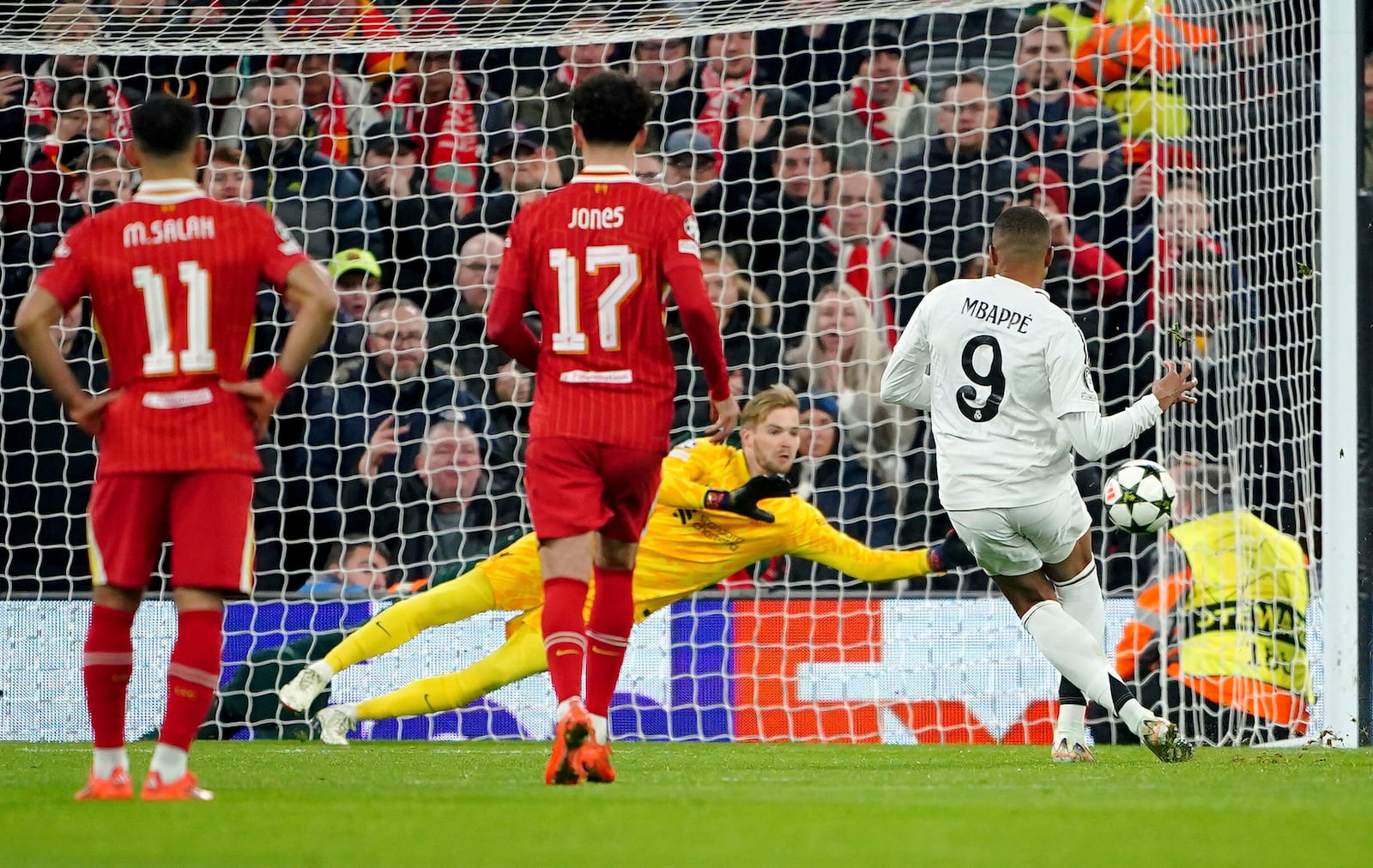 Liverpool goalkeeper Caoimhin Kelleher saves a penalty from Real Madrid's Kylian Mbappe during the Champions League opening phase soccer match between Liverpool and Real Madrid at Anfield Stadium, Liverpool, England, Wednesday, Nov. 27, 2024. (Peter Byrne/PA via AP)