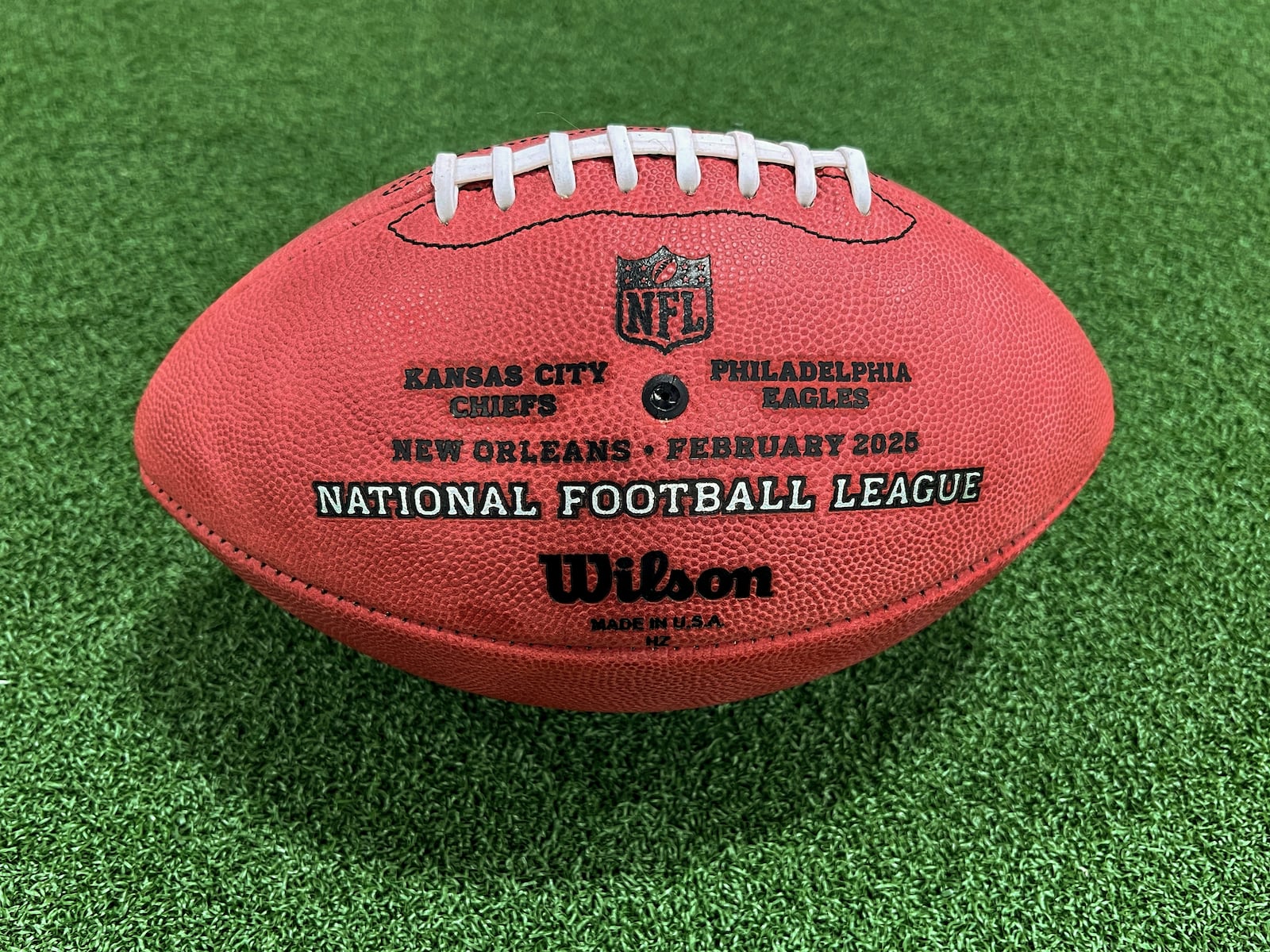 One of the official balls for the NFL Super Bowl football game is seen at the Wilson Sporting Goods football factory, Monday, January 27, 2025, in Ada, Ohio. (AP Photo/Patrick Aftoora-Orsagos)