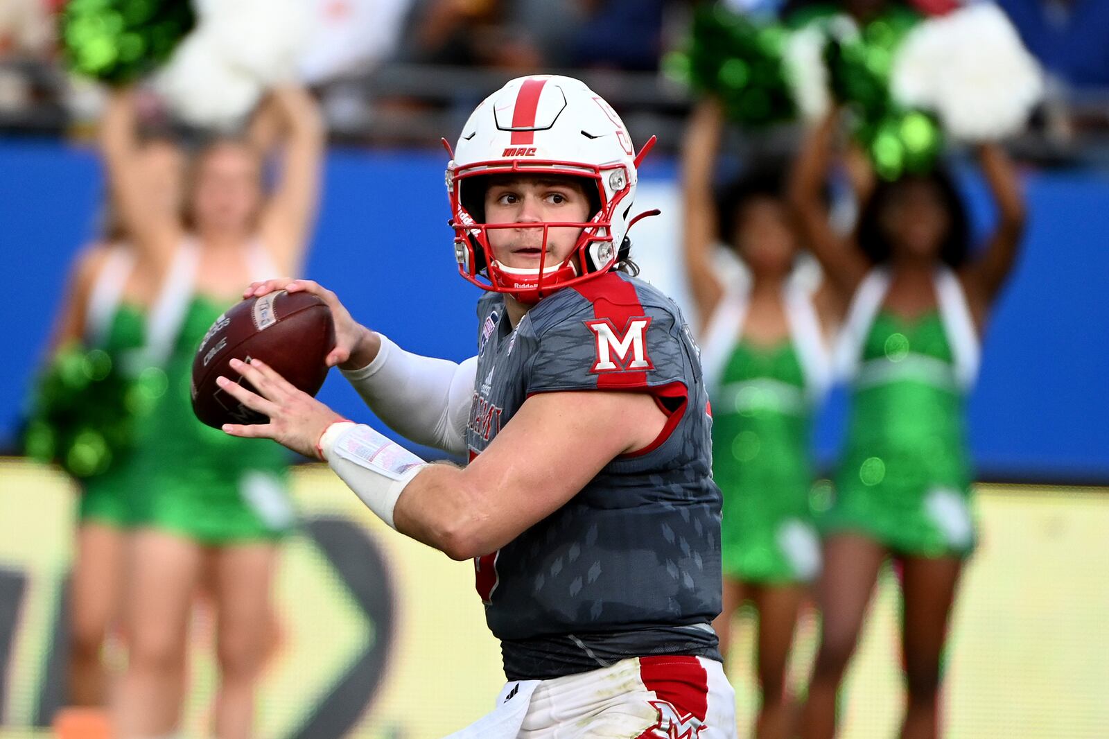 Miami (Ohio) quarterback Brett Gabbert looks for a receiver during the second half of the team's Frisco Football Classic NCAA college football game against North Texas in Frisco, Texas, Thursday, Dec. 23, 2021. (AP Photo/Matt Strasen)