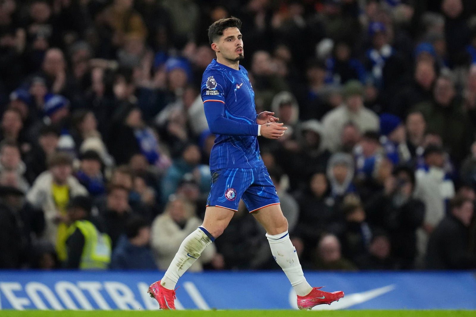 Chelsea's Pedro Neto celebrates after scoring his side's opening goal during the English Premier League soccer match between Chelsea and West Ham United at Stamford Bridge stadium in London, Monday, Feb. 3, 2025. (AP Photo/Kirsty Wigglesworth)