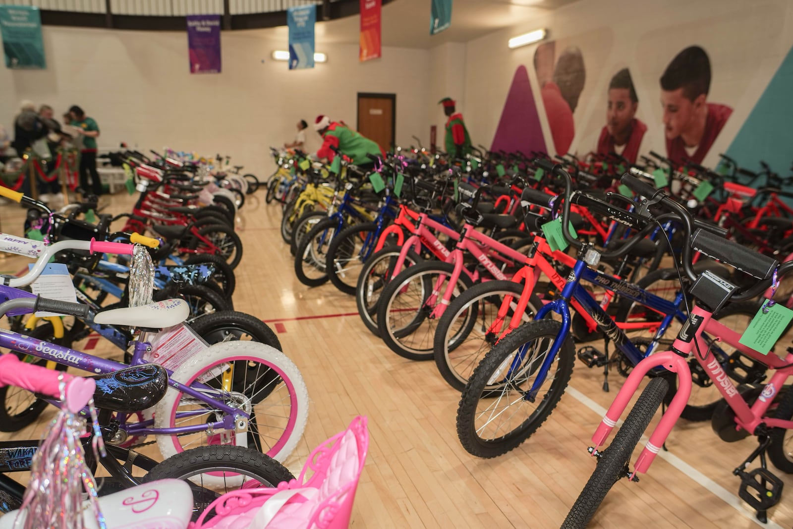 Children who won a raffle received free bikes last week during the 17th annual Louella Thompson's Feed the Hungry Toy Giveaway at the Greater Miami Valley YMCA. PHOTO COURTESY OF ALFREDO PETERS