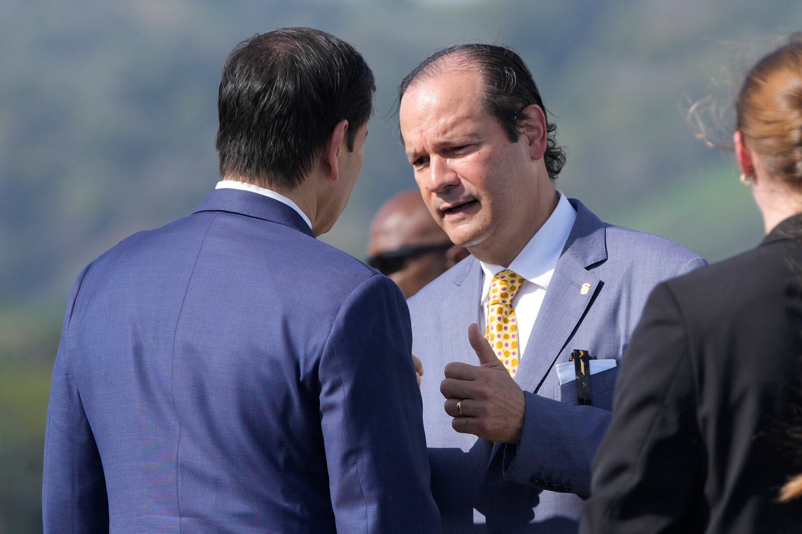 Secretary of State Marco Rubio speaks with Panama's Foreign Minister Javier Martinez-Acha before boarding a plane at Panama Pacifico International Airport in Panama City, Monday, Feb. 3, 2025, en route to El Salvador. (AP Photo/Mark Schiefelbein, Pool)