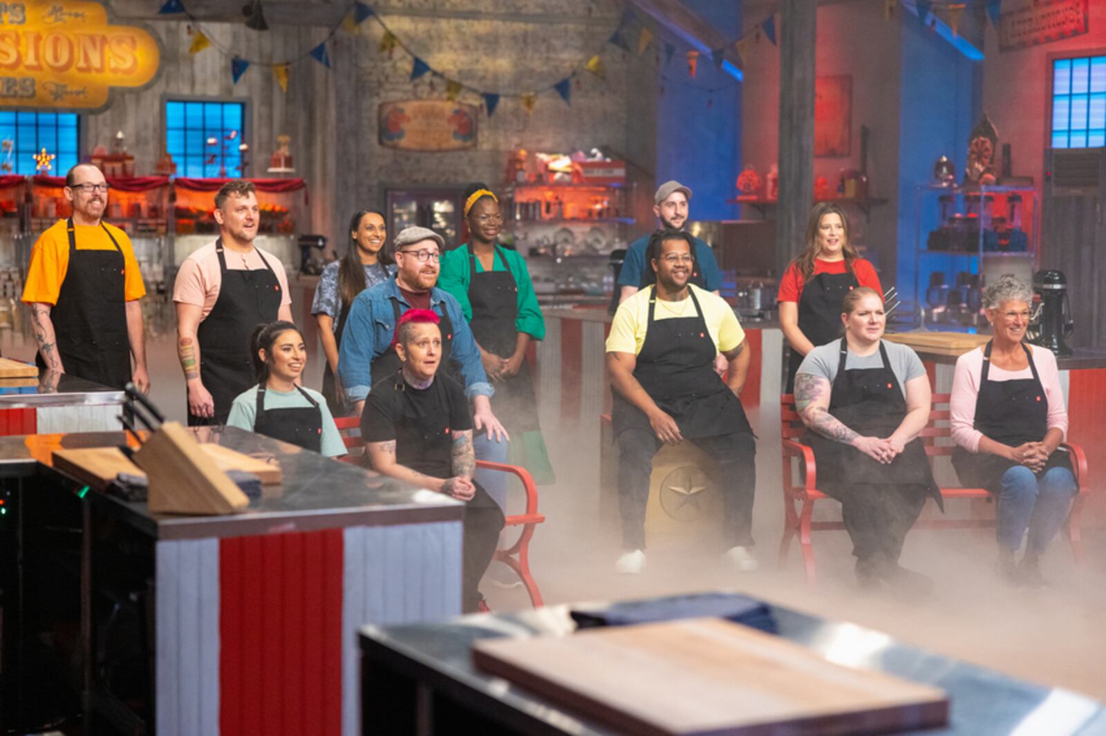 Contestants (left to right) Chad Conklin, James Cox, Mandi De Toro, Dan Pivovar, Hollie Fraser, Adesuwa Elaiho, Michael Yu, Ryan Mccord, Christa Aylward, Stacy Day and Phoebe Martinson receive their first challenge on Food Network's Halloween Baking Championship, Season 9.