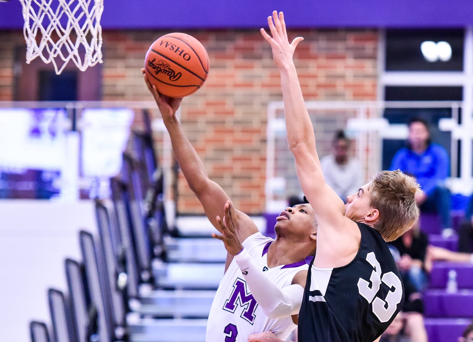 Middletown’s Kei’Aunte Powell is defended by Lakota East’s Grant Spicer during their game Jan. 8 at Middletown’s Wade E. Miller Arena. East won 61-47. NICK GRAHAM/STAFF