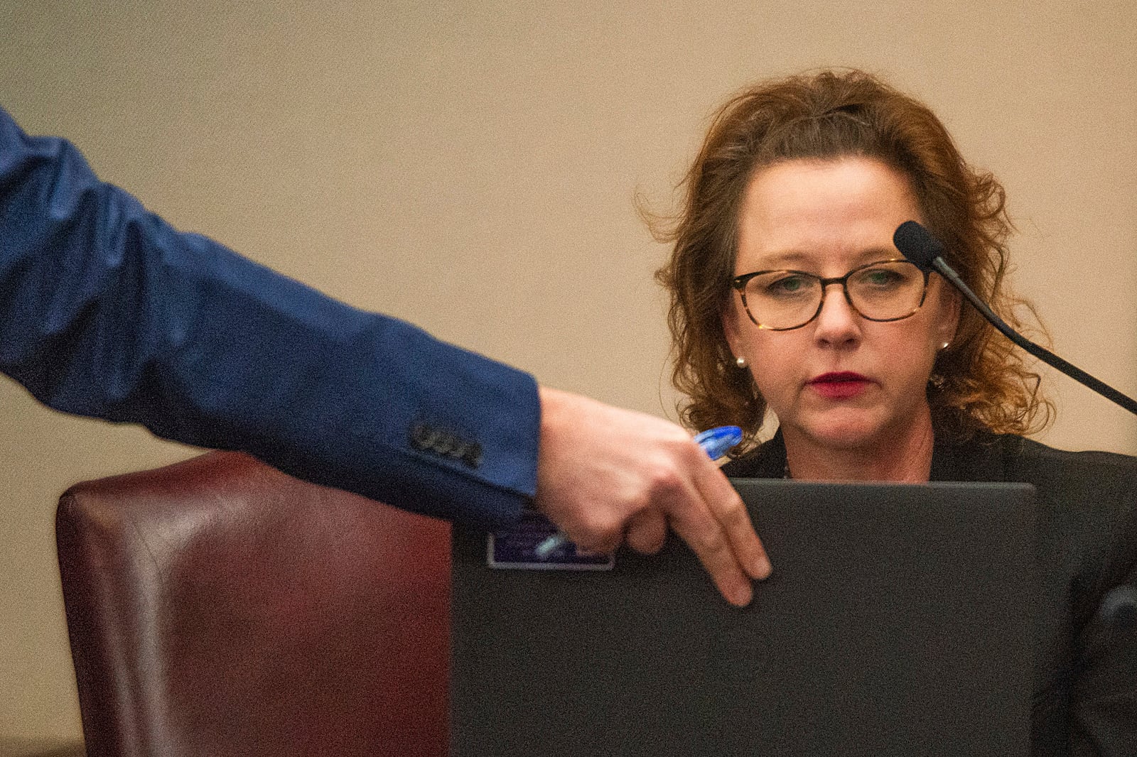 Jackie Johnson looks at a laptop placed in front of her by prosecutor John Fowler, Tuesday, Feb. 4, 2025, in Brunswick, Ga. (Terry Dickson/The Brunswick News via AP, Pool)