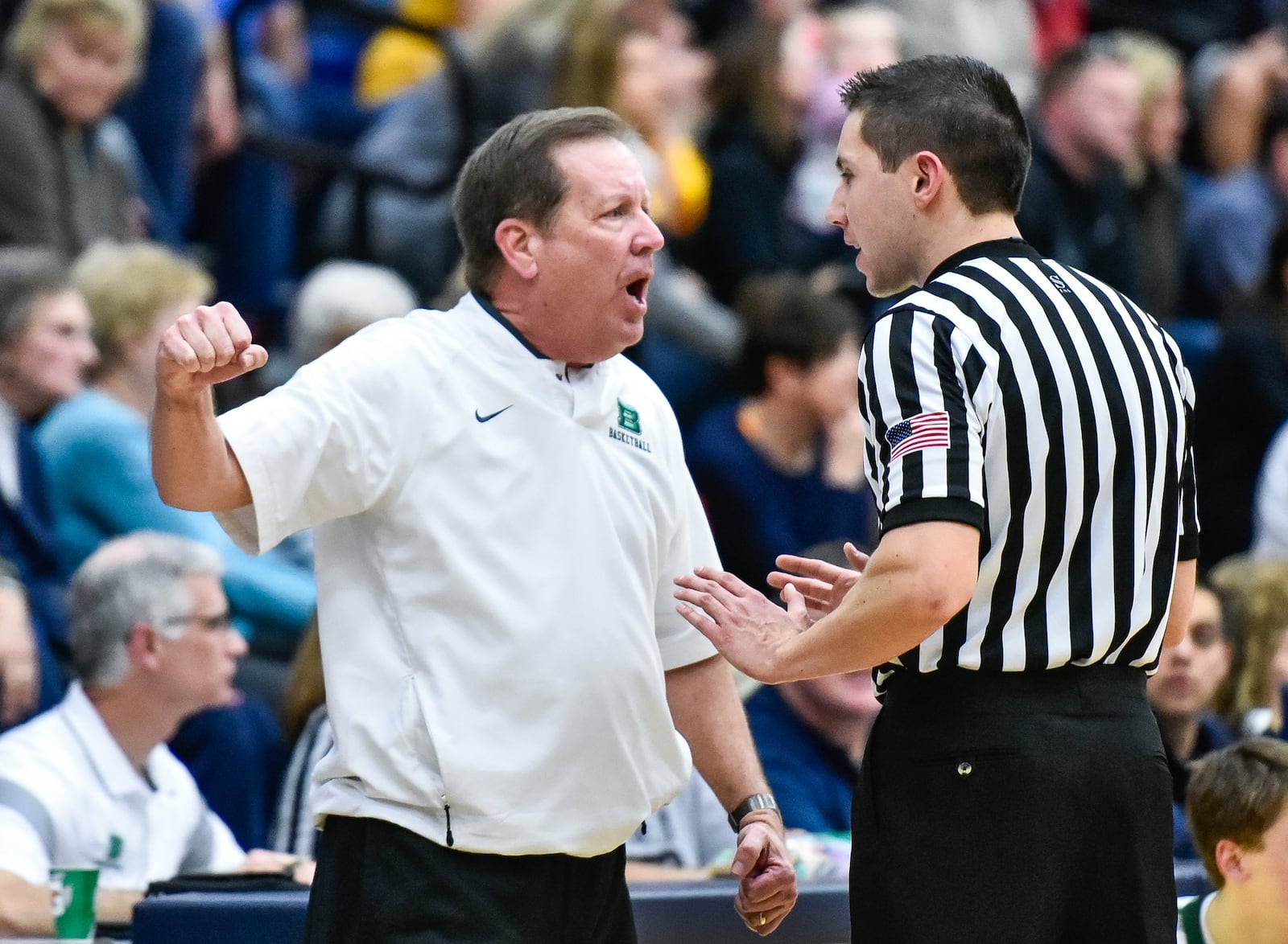 Badin coach Gerry Weisgerber questions a call during a Division II sectional semifinal against Alter on Feb. 27, 2018, at Fairmont’s Trent Arena in Kettering. Alter won 60-51. NICK GRAHAM/STAFF