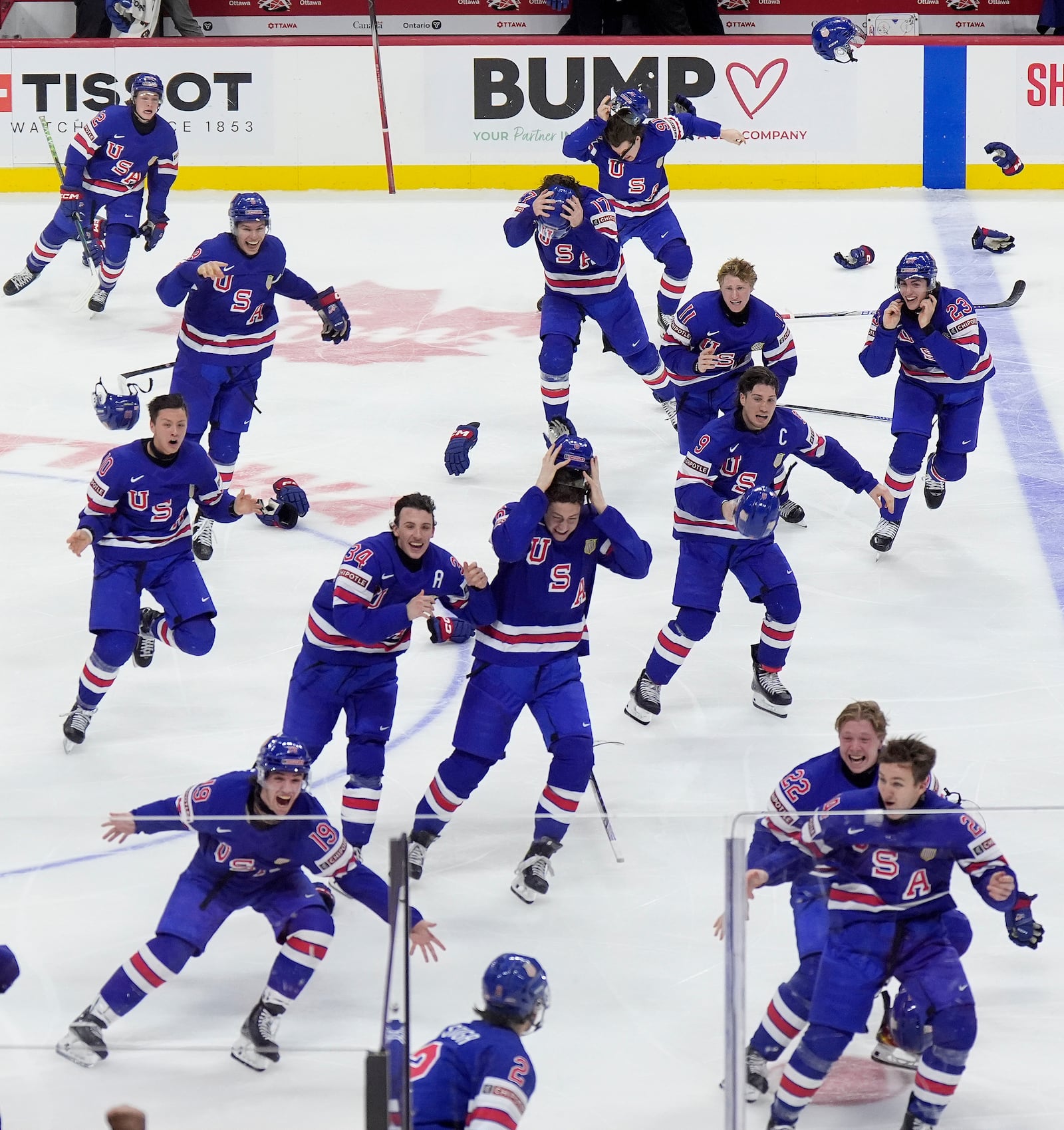 United States players celebrate after their overtime win over Finland in the IIHF World Junior Hockey Championship gold medal game in Ottawa, Ontario, Sunday, Jan. 5, 2025. (Adrian Wyld/The Canadian Press via AP)