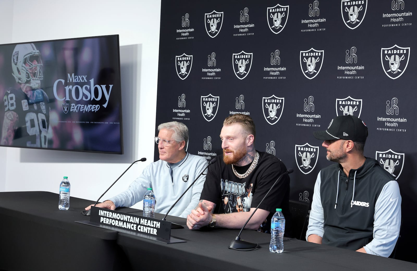 Las Vegas Raiders defensive end Maxx Crosby, center, speaks during an NFL football news conference with head coach Pete Carroll, left, and general manager John Spytek, Wednesday, March 5, 2025, in Henderson, Nev. (Steve Marcus/Las Vegas Sun via AP)