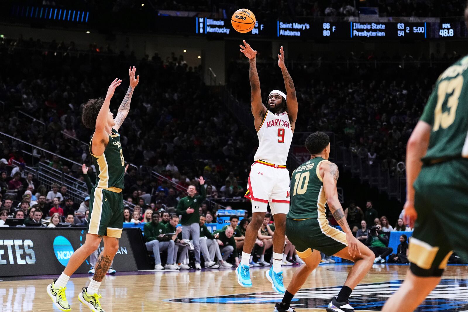 Maryland guard Selton Miguel (9) shoots against Colorado State guard Kyan Evans, left, during the second half in the second round of the NCAA college basketball tournament Sunday, March 23, 2025, in Seattle. (AP Photo/Lindsey Wasson)