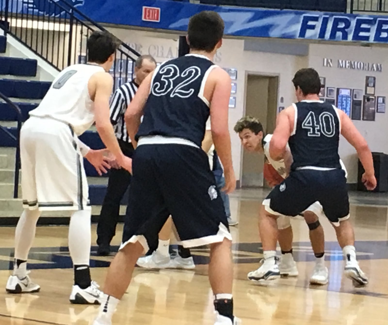 Badin’s Caleb Meyer is closely defended by Valley View’s Logan Hannah (40) during Saturday afternoon’s Division II sectional game at Fairmont’s Trent Arena. That’s the Rams’ Jakob Tipton (0) and the Spartans’ Ben Herman (32) also near the play. RICK CASSANO/STAFF