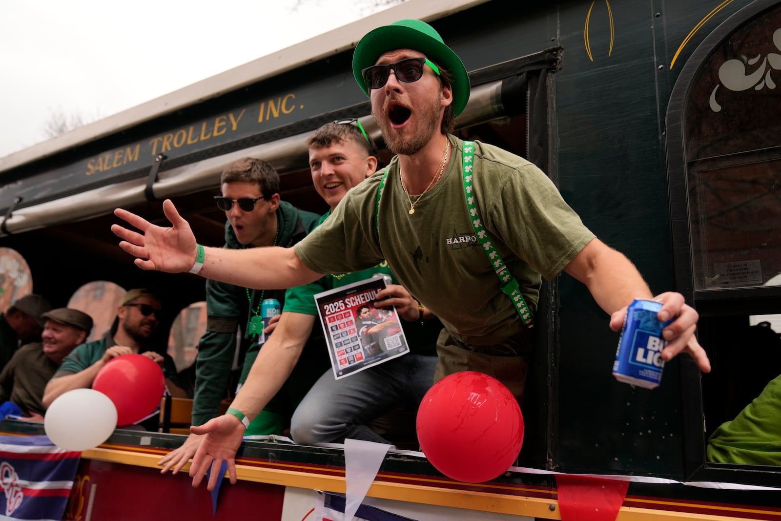 A man on a float encourages the crowd to cheer louder during the St. Patrick's Day parade, Sunday, March 16, 2025, in Boston, Mass. (AP Photo/Robert F. Bukaty)