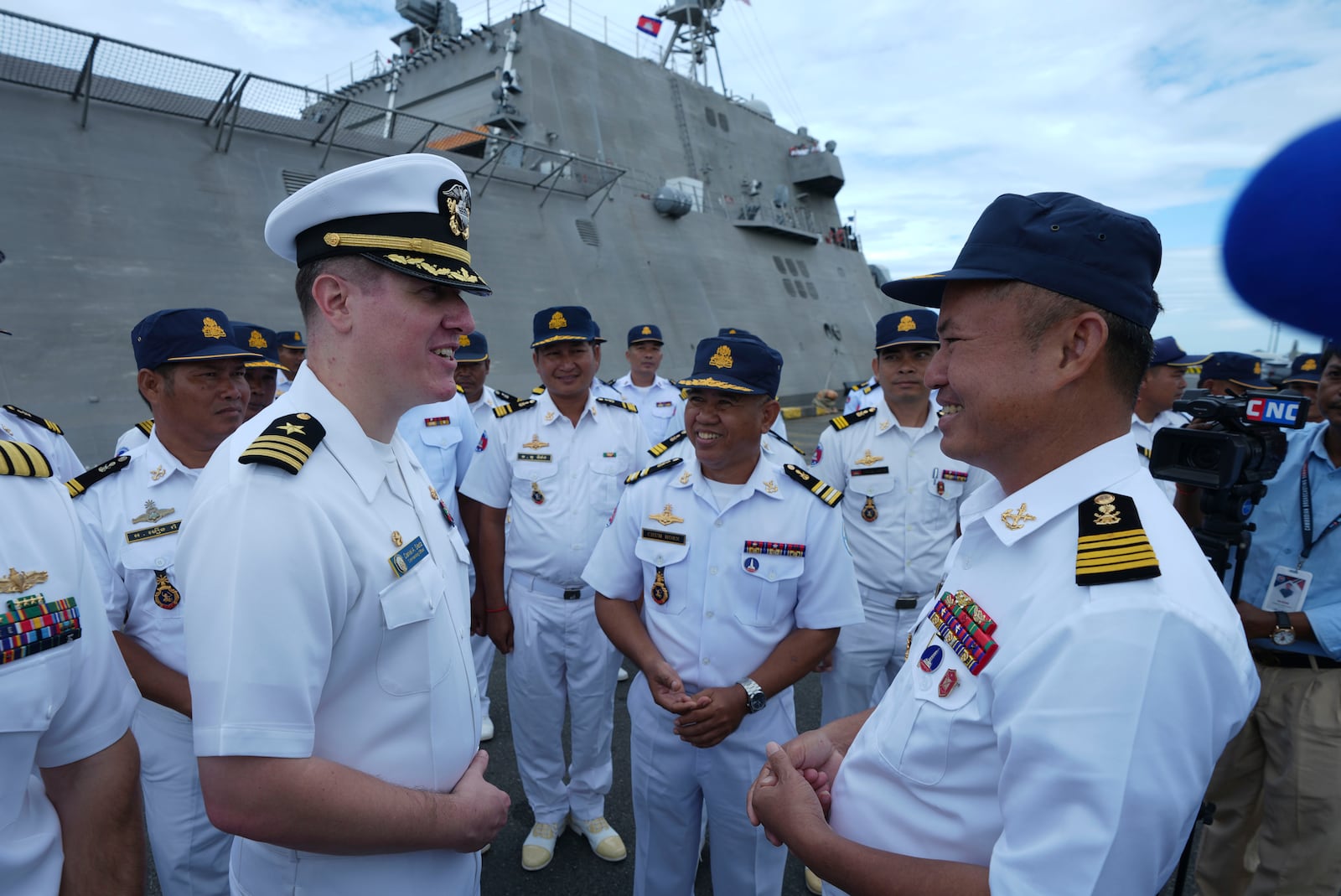 Daniel A. Sledz, left, commanding officer of USS Savannah, talks with a Cambodian naval staff member as it arrives for a port call at Sihanoukville port, Cambodia, Monday, Dec. 16, 2024. (AP Photo/Heng Sinith)