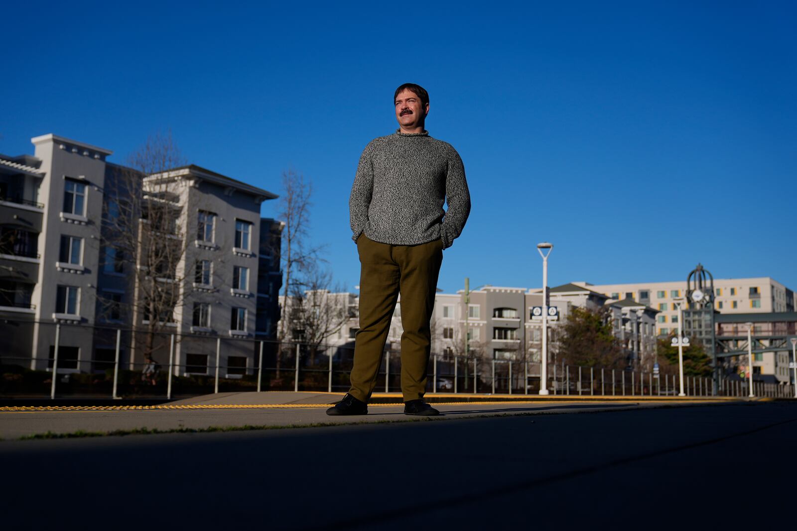 Jonah Paul, Digital Marketing Analyst at Employment Development Department, stands for photographs at the Jack London Square Amtrak Train station in Oakland, Calif., Friday, March 7, 2025. (AP Photo/Jeff Chiu)