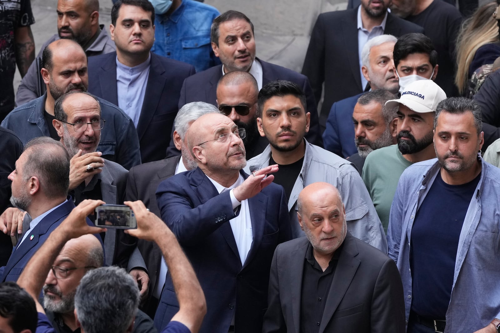 Iran's parliament speaker Mohammad Bagher Qalibaf, center, visits the site of Thursday's Israeli airstrike in Beirut, Lebanon, Saturday, Oct. 12, 2024. (AP Photo/Hassan Ammar)