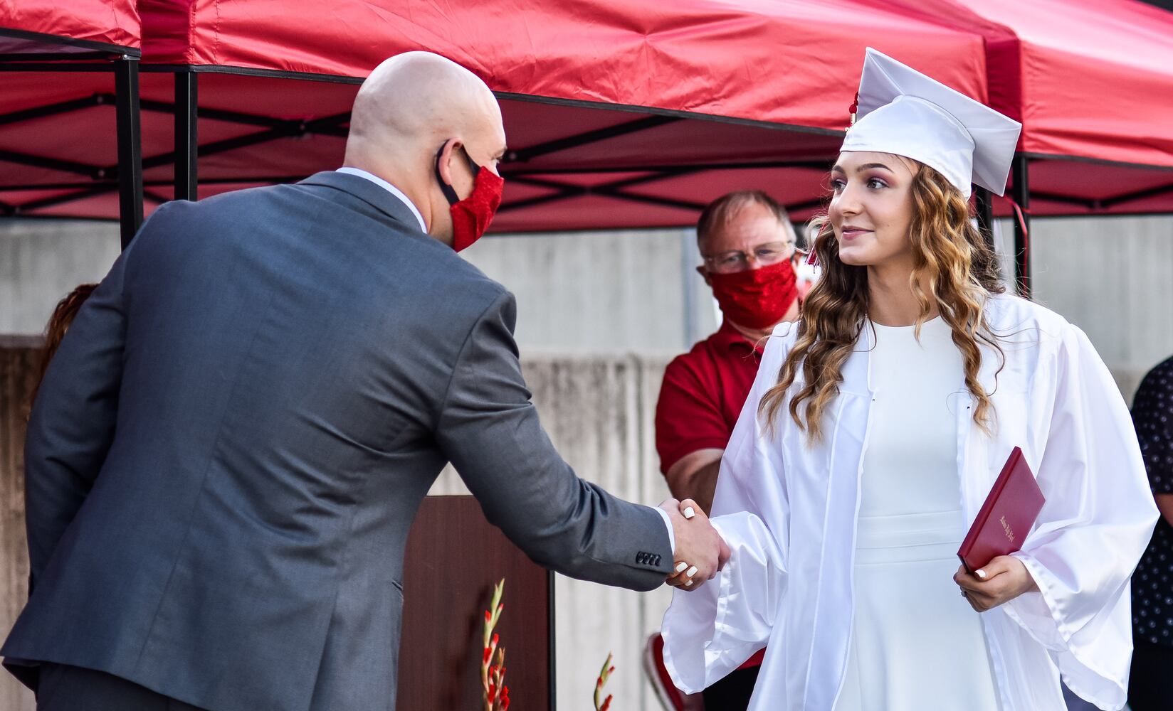 Madison High School drive-thru graduation ceremony at Land of Illusion