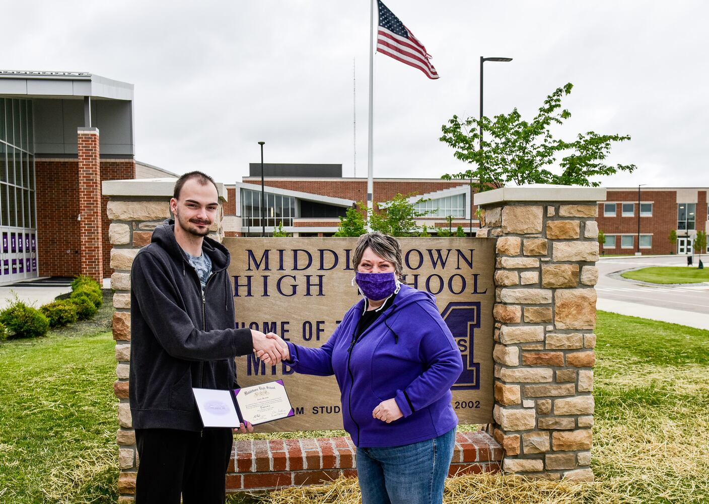 Middletown High School graduates drive up to receive diplomas