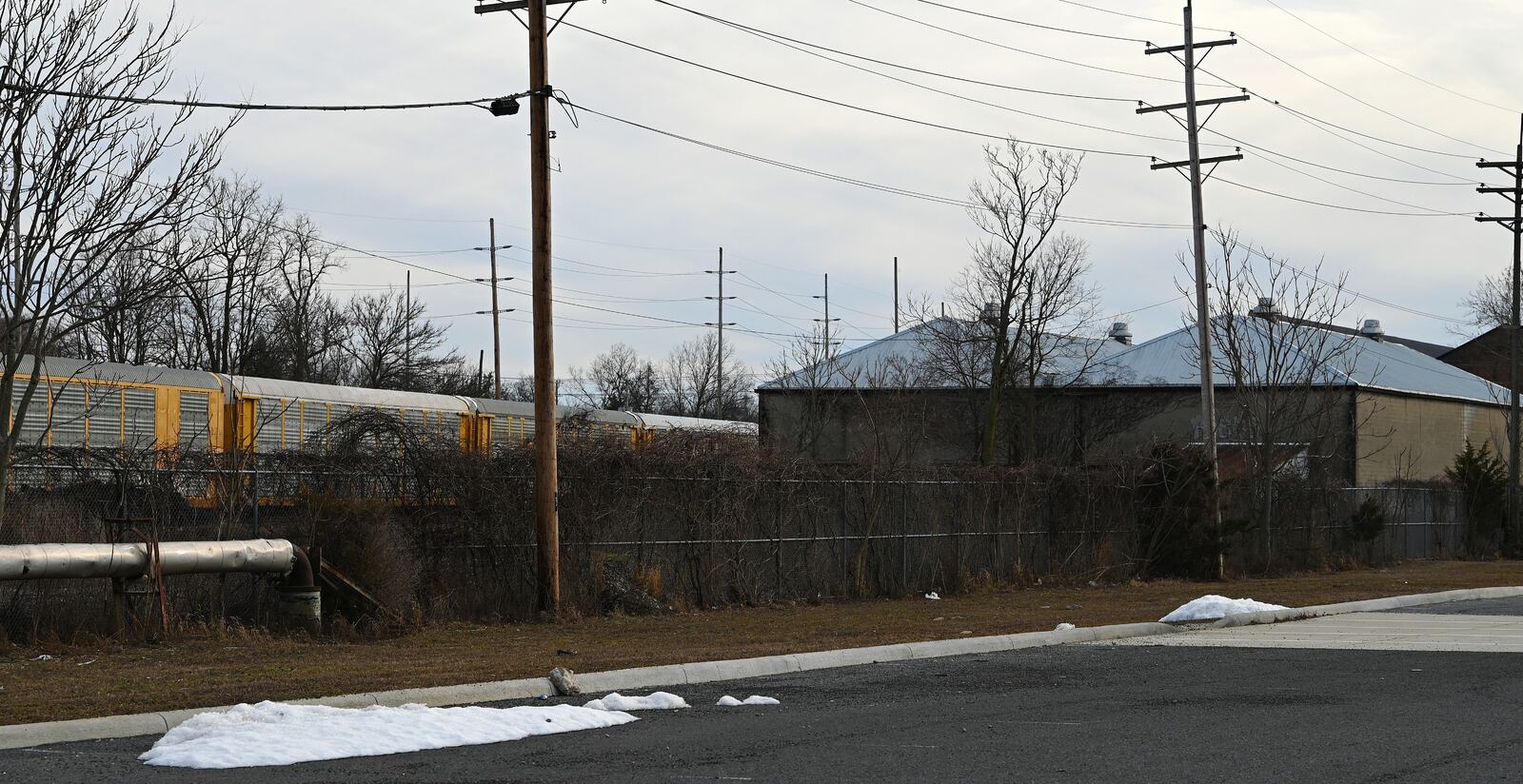 AECOM, the consultant hired by the city of Hamilton for a passenger rail feasibility study, recommended a site near the South Hamilton Crossing and a site near the proposed North Hamilton Crossing route for a passenger rail station. Pictured is the site for the northern of the two recommended stations. The site is next to the Spooky Nook overflow parking lot owned by the city of Hamilton, and is also where Kornylak Corporation owns property. MICHAEL D. PITMAN/STAFF