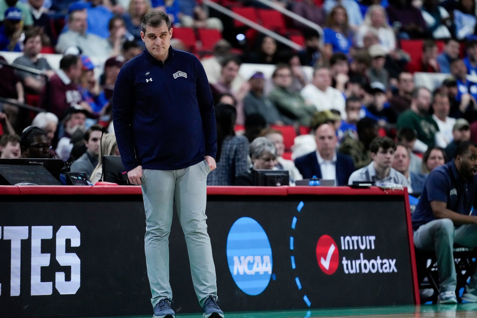 Mount St. Mary's head coach Donny Lind watches during the first half in the first round of the NCAA college basketball tournament against Duke, Friday, March 21, 2025, in Raleigh, N.C. (AP Photo/Stephanie Scarbrough)