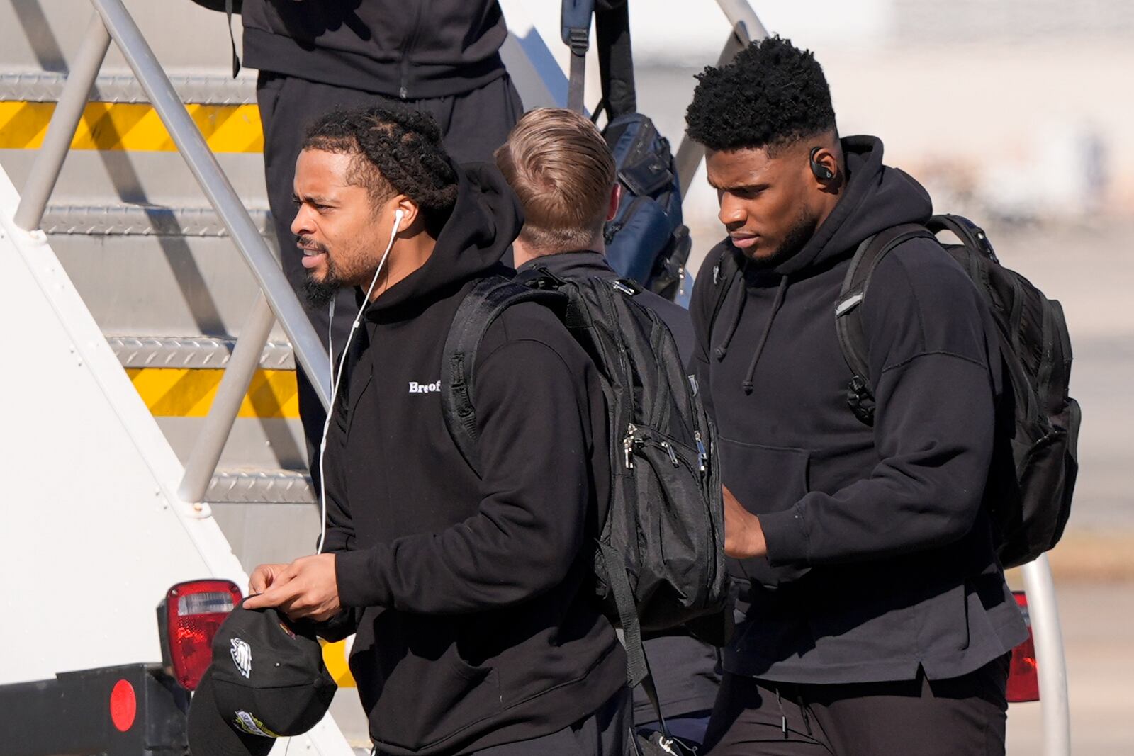 Philadelphia Eagles defensive tackle Jordan Davis (90) arrives at New Orleans international airport, Sunday, Feb. 2, 2025, in Kenner, La. ahead of the NFL Super Bowl 59 football game between the Philadelphia Eagles and the Kansas City Chiefs. (AP Photo/Gerald Herbert)