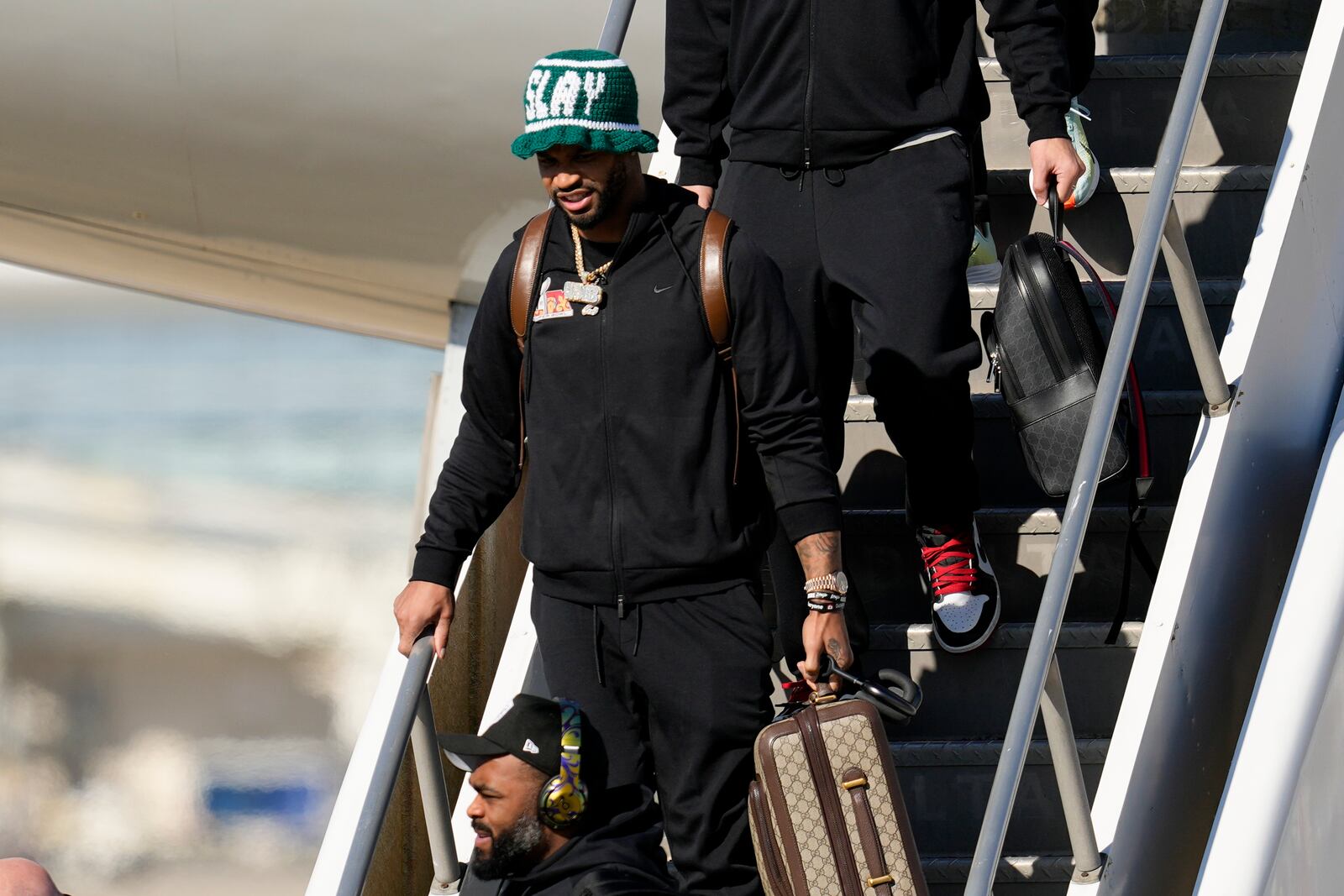 Philadelphia Eagles cornerback Darius Slay Jr. (2) arrives at New Orleans international airport, Sunday, Feb. 2, 2025, in Kenner, La. ahead of the NFL Super Bowl 59 football game between the Philadelphia Eagles and the Kansas City Chiefs. (AP Photo/David J. Phillip)